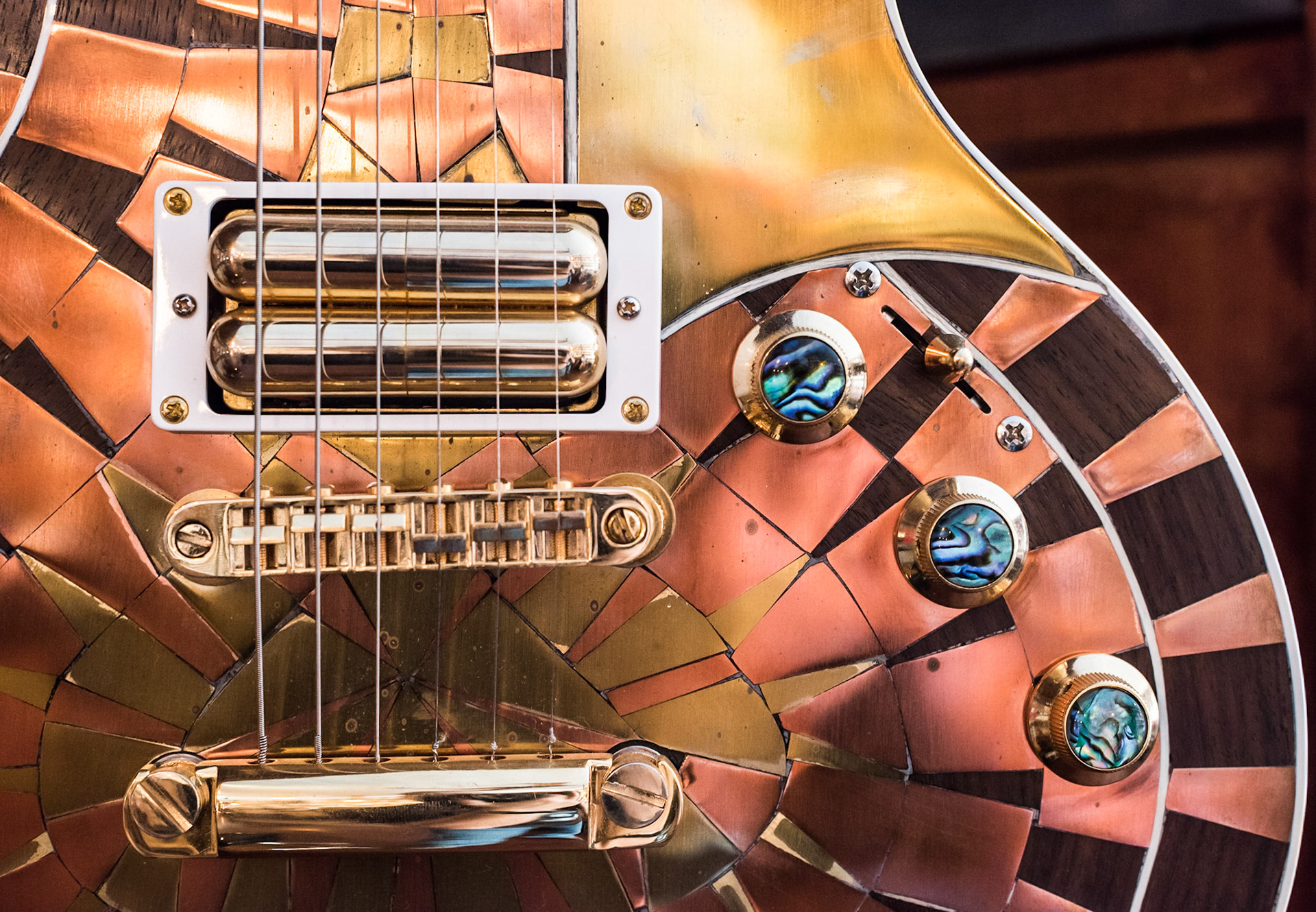 Details on a shiny electric guitar seen at Hill Country Guitars in Dripping Springs, Texas.