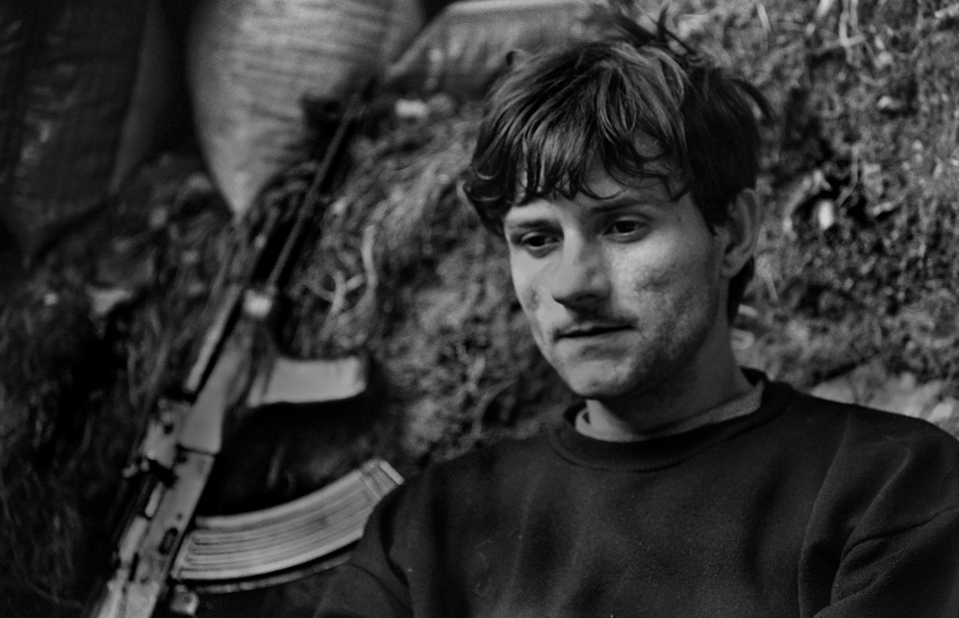 A Bosnian government soldier sits in a frontline position on the perimeter of the besieged capital Sarajevo on May 23, 1993.
