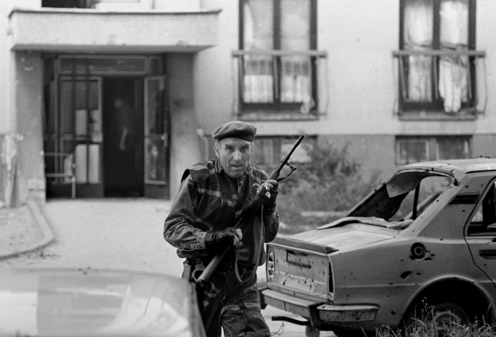 Bosnian government soldiers engage Bosnian Serbs in house to house fighting in Sarajevo on June 24, 1992. The Dobrinja neighbourhood was built to house athletes for the 1984 winter olympic games.