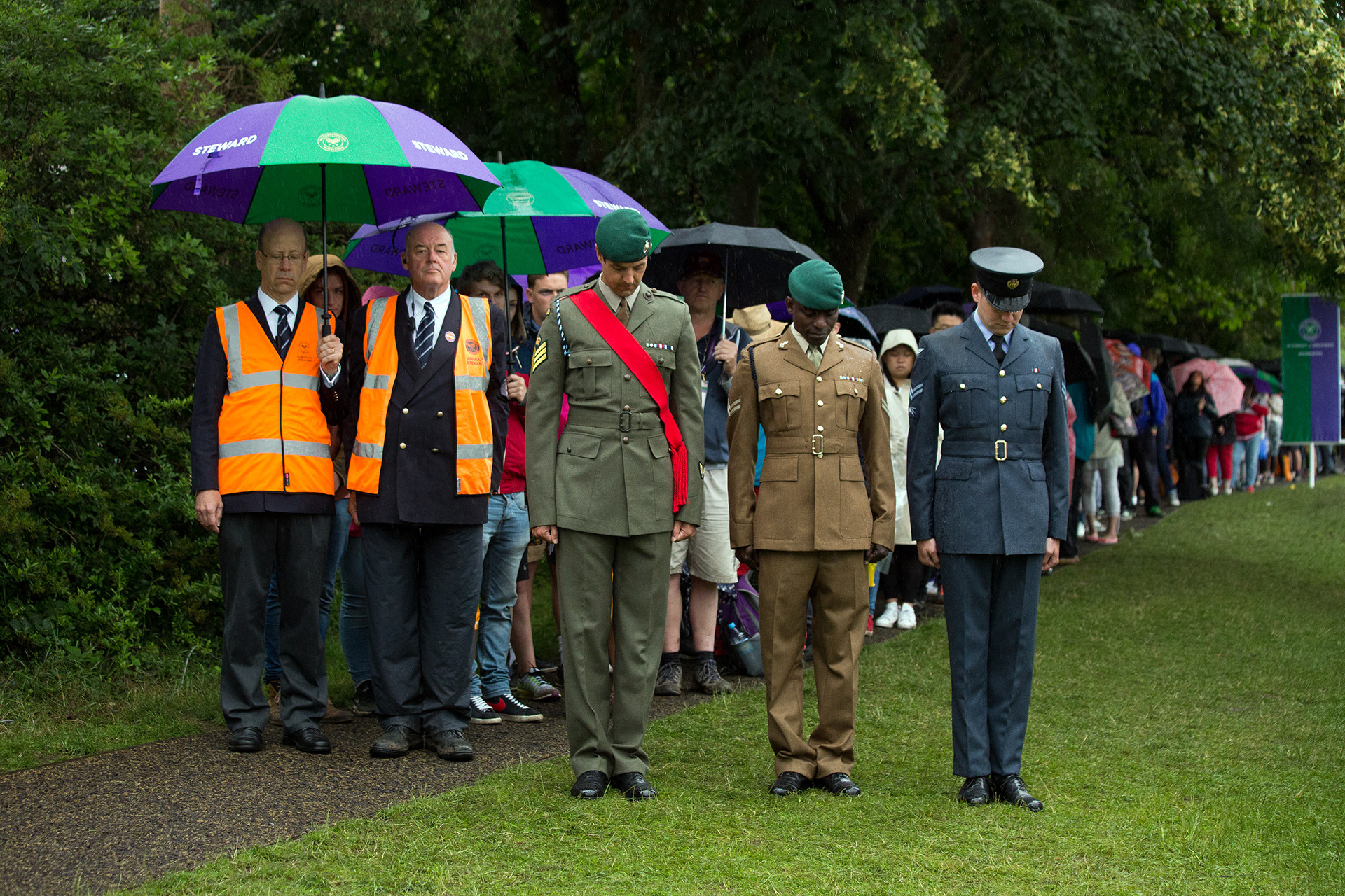 Members of the Army Forces bow their heads during the silence to commemorate the 100th anniversary of the Battle of The Somme, Wimbledon