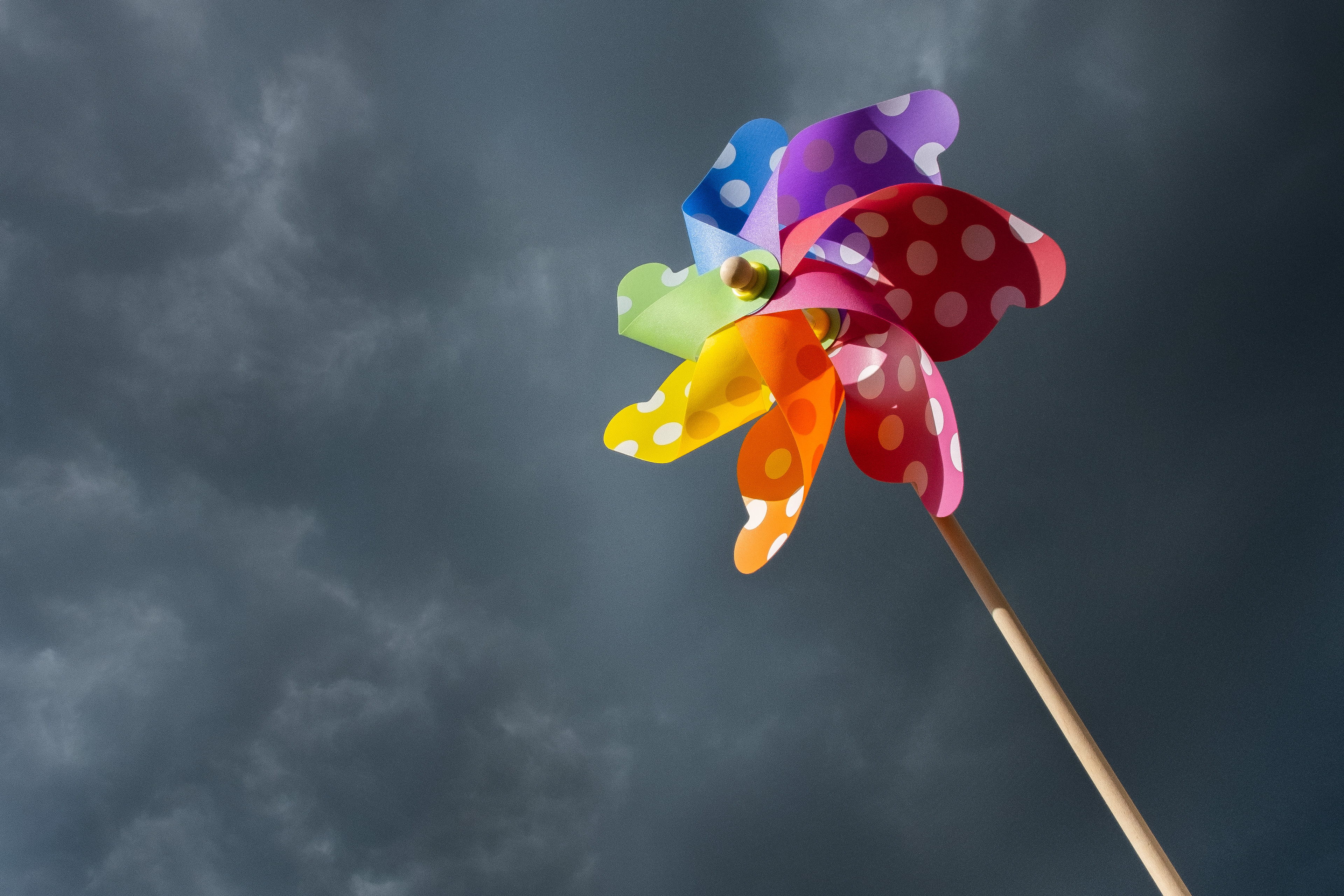 Child's windmill toy just before a storm in Bournemouth