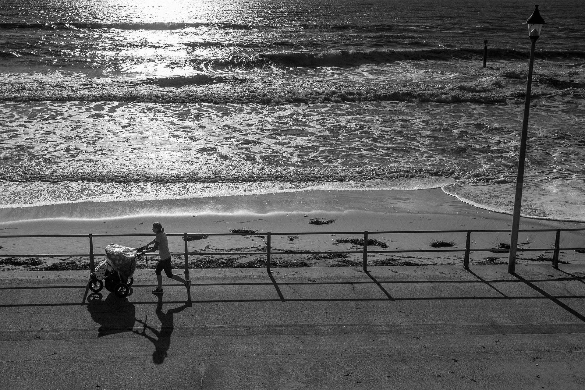 Jogger with a pushchair, Fisherman's Walk, Bournemouth