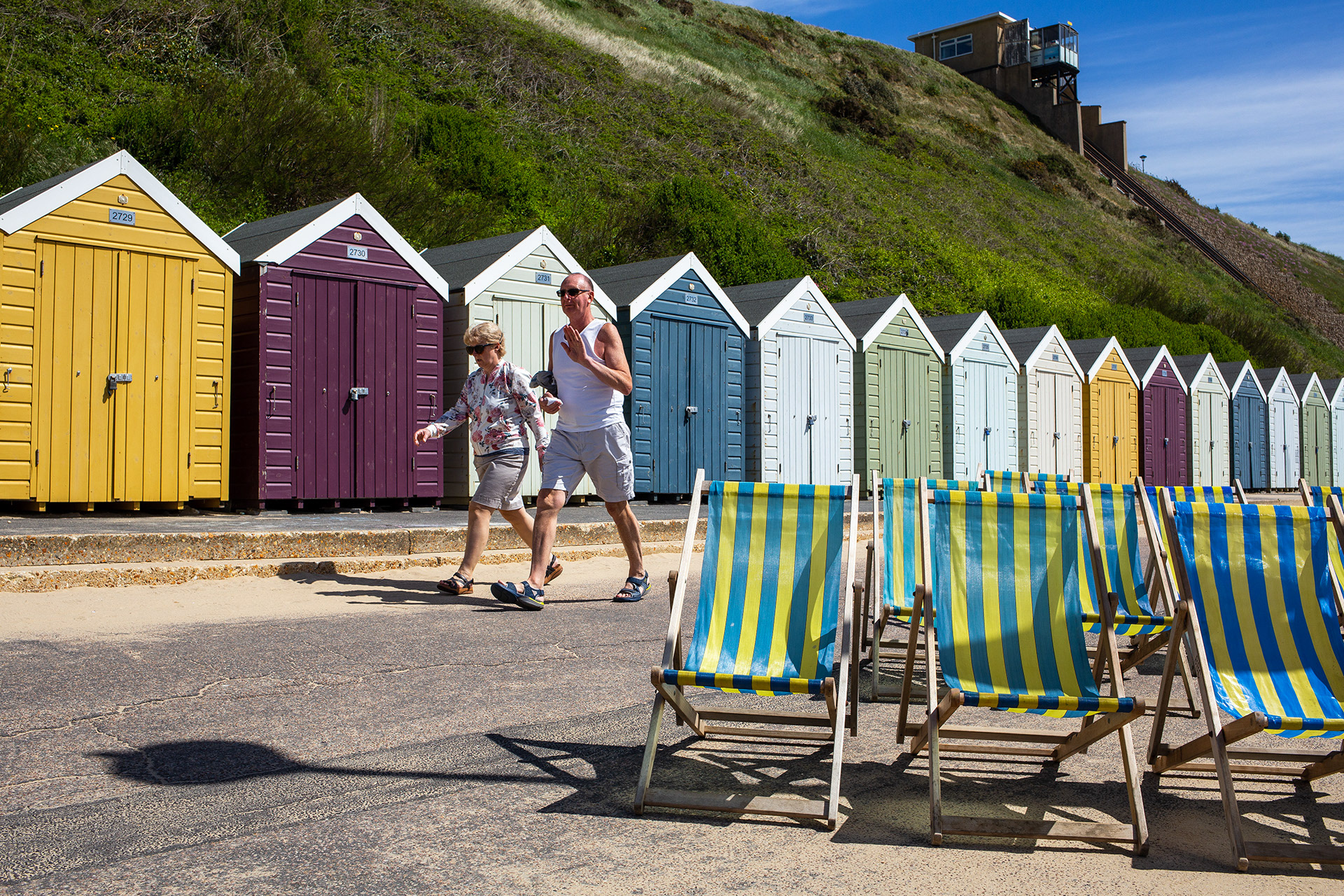 Couple power walking on the beach at Fisherman's Walk, Bournemouth