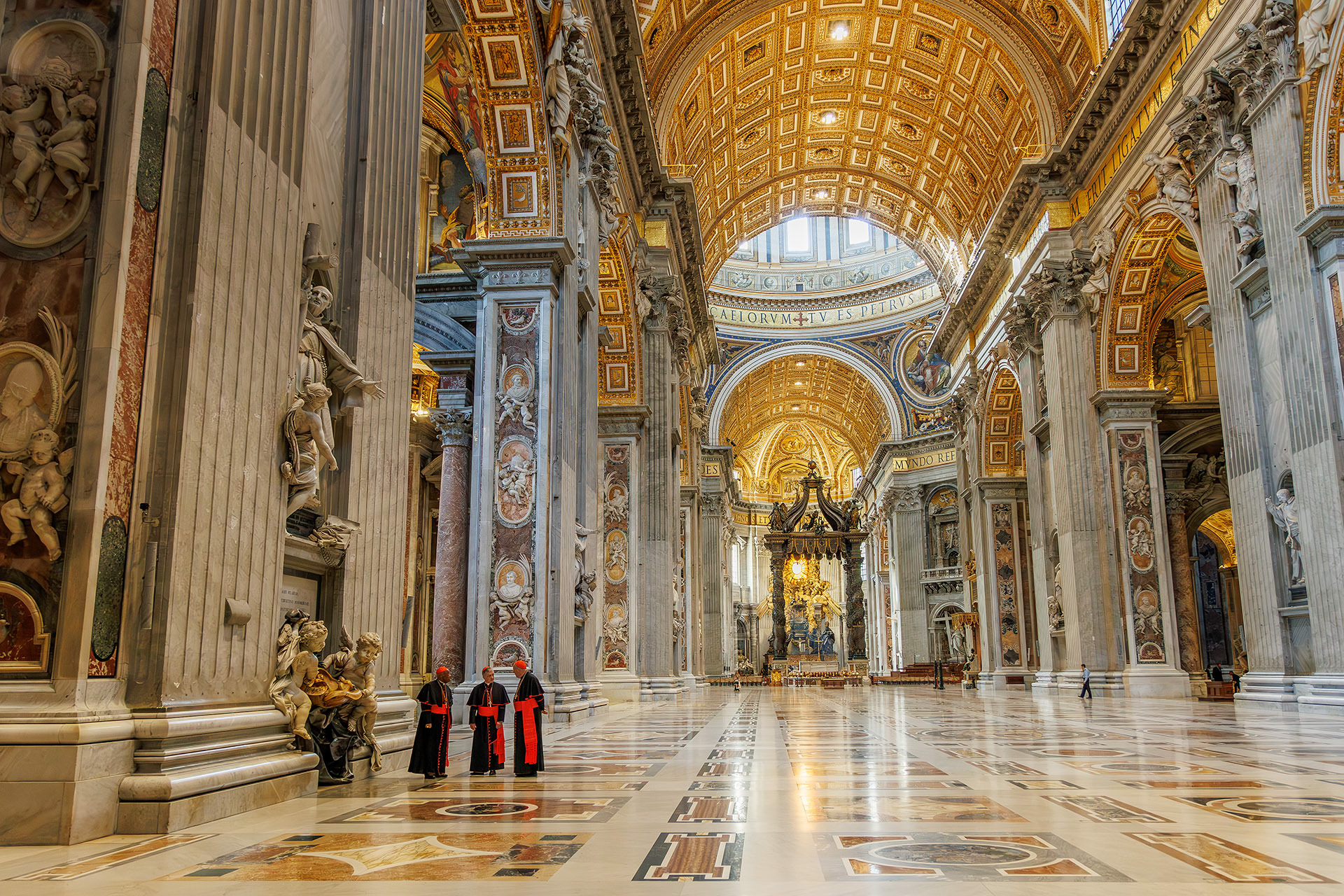 Three Cardinals walk through an empty St Peter's Basilica in the Vatican