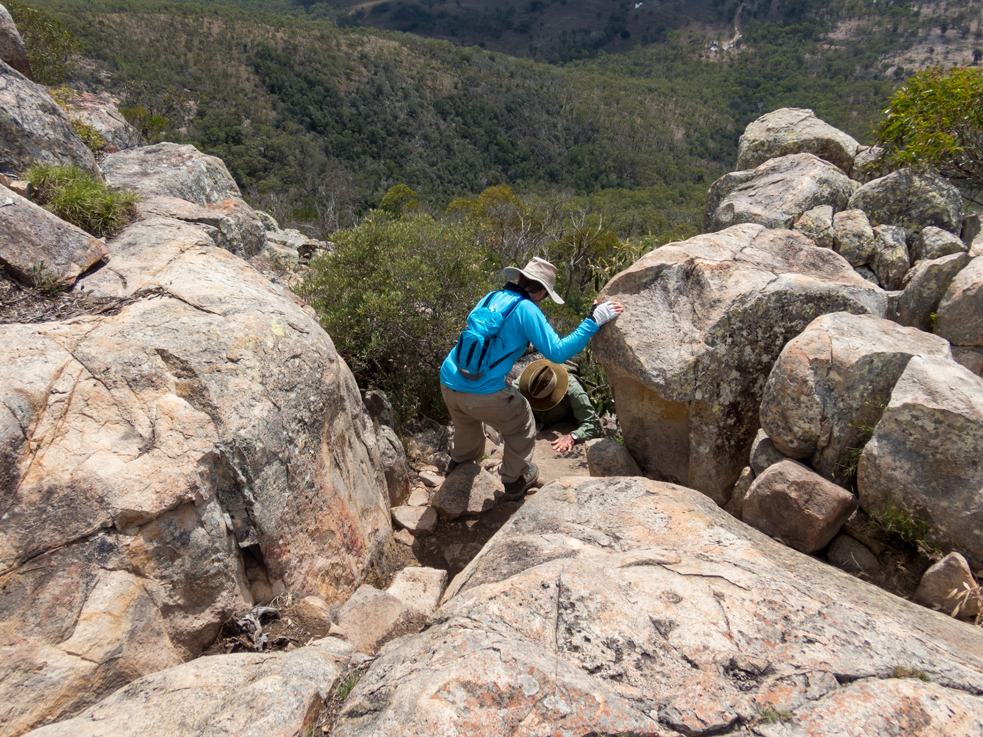 Tricia and Alan finding their footing through the boulders on the mountain descent