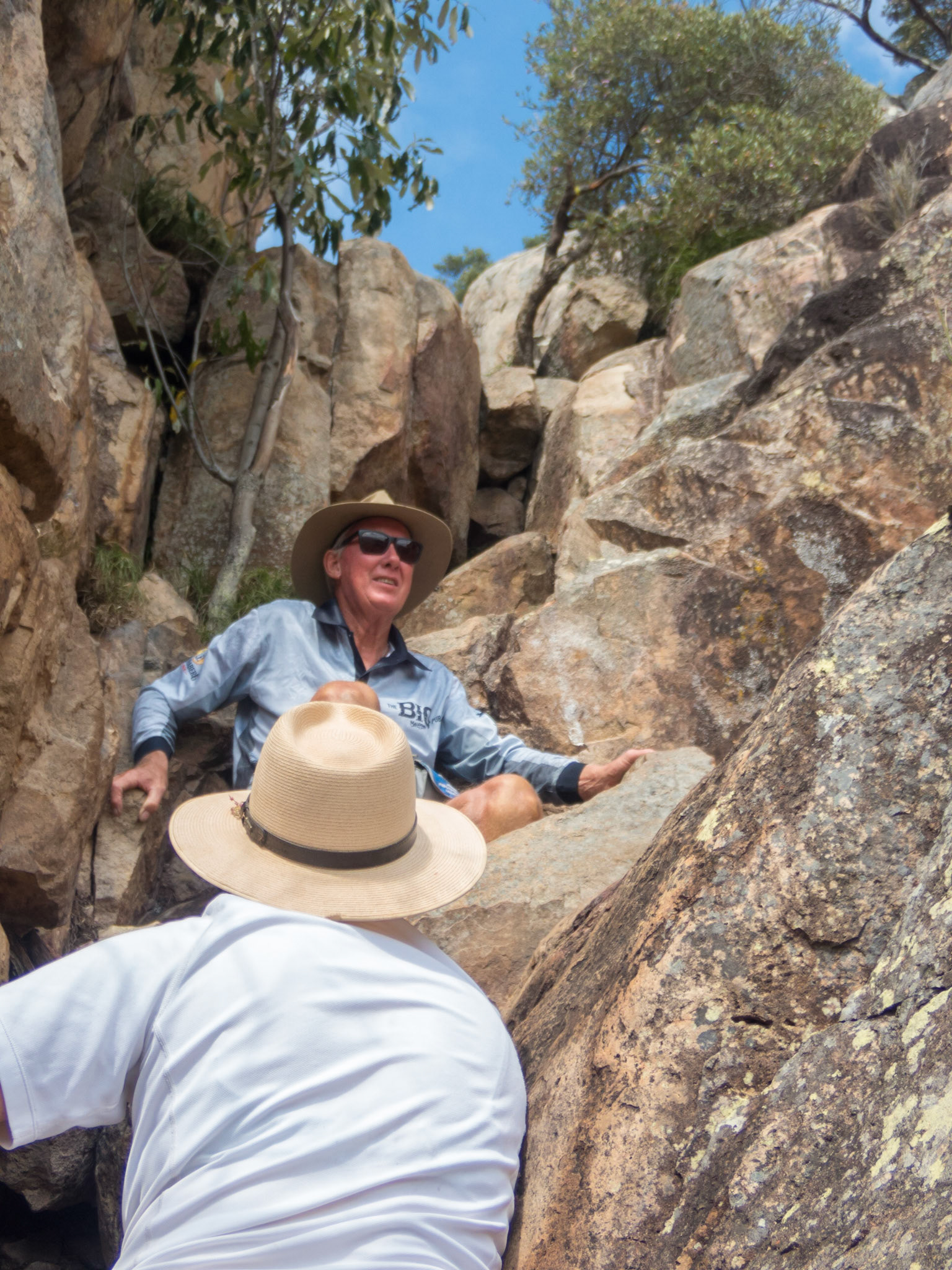 Paul and Janella finding their way up between the boulders on Mount Walsh
