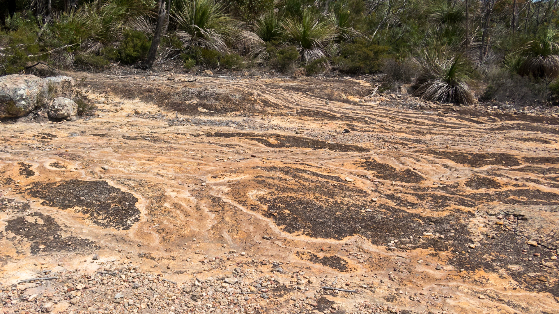 Striated patterns on the mountain rock face.