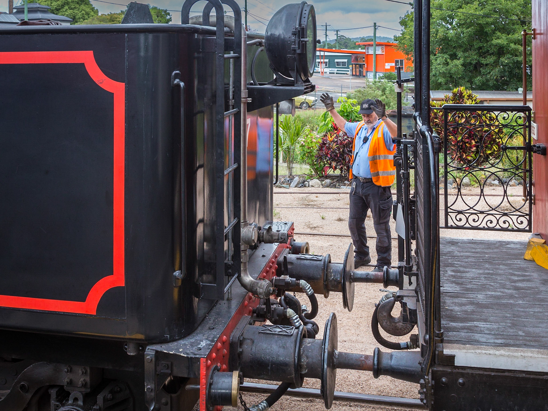 Locomotive backed to hitch up the passenger cars.