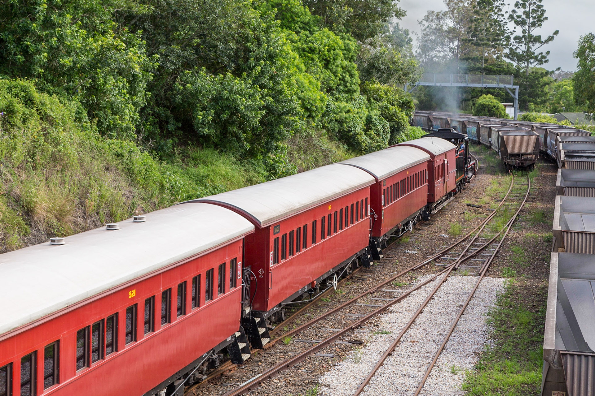 Train moving up the main line before changing points and reversing back to the station platform.