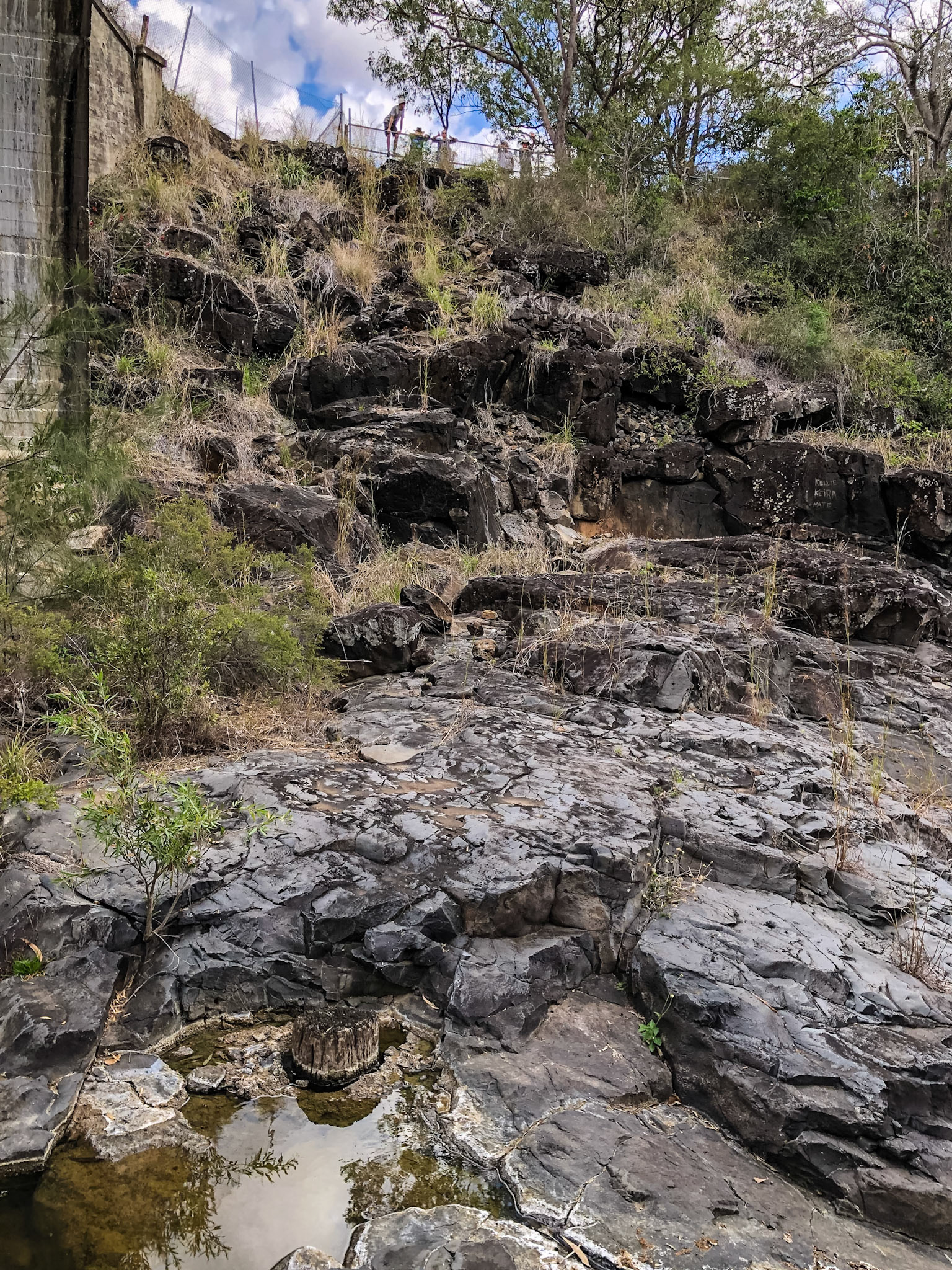 Some of our group at the safety barricade fence above the creek at Chowey Bridge.