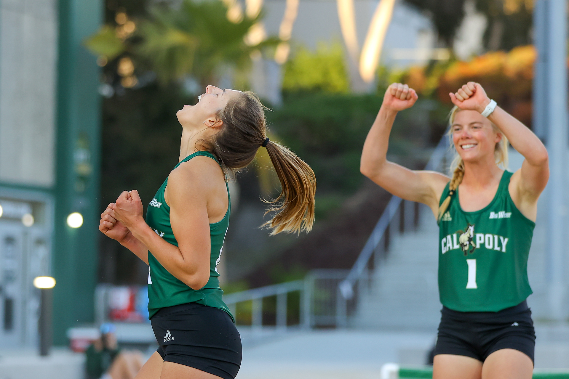 Tia Miric (2) and Mariah Whalen (1) react to winning their court as #5 Cal Poly Beach Volleyball faces #10 Hawaii at Swanson Beach Volleyball Complex on Saturday, March 27, 2021. Kyle Calzia / Cal Poly Athletics