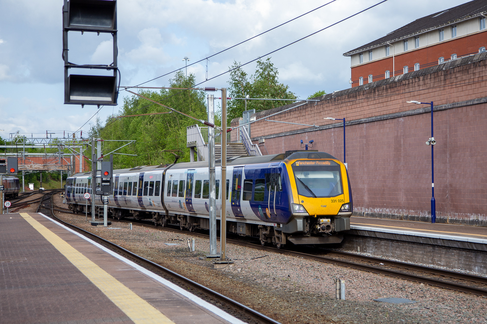 Northern 331025 arriving at Manchester Airport