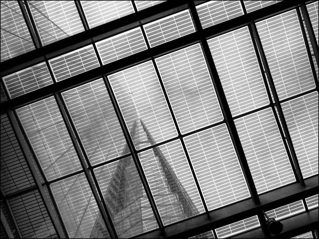 London's Shard skyscraper viewed from beneath the roof of London Bridge railway station.