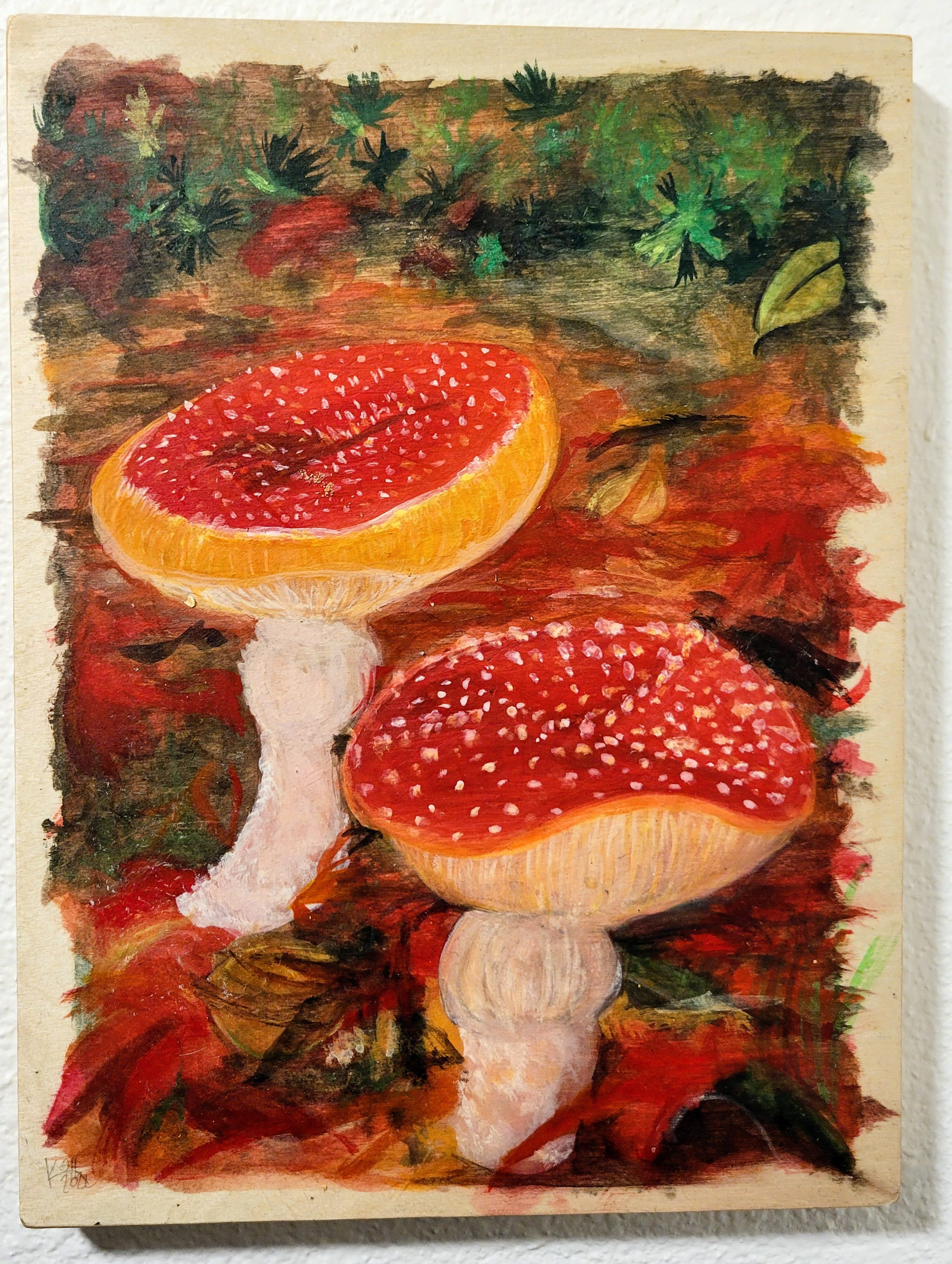 watercolor painting of two red mushrooms in the fall leaves