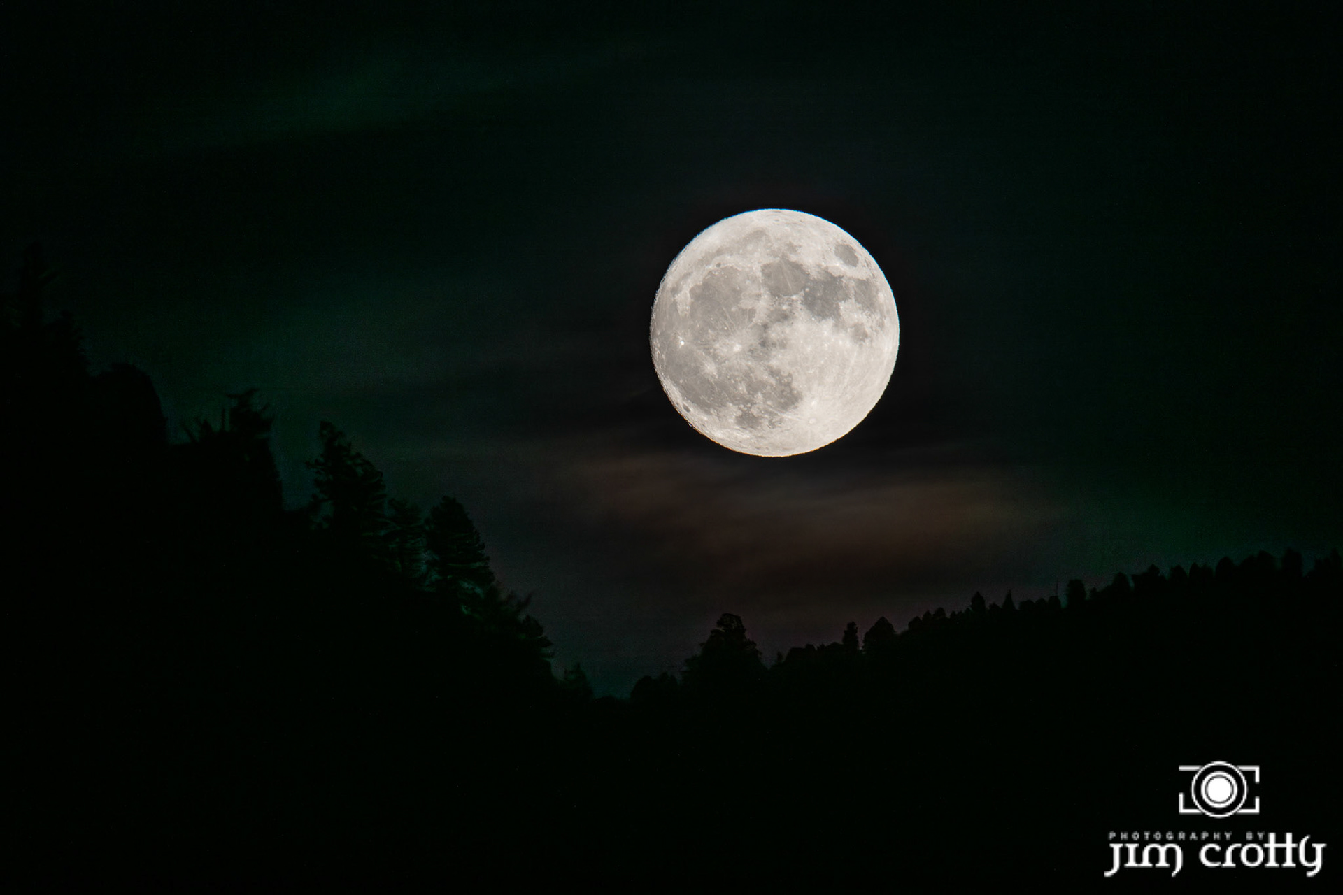 August moonrise over Red River, New Mexico by Jim Crotty