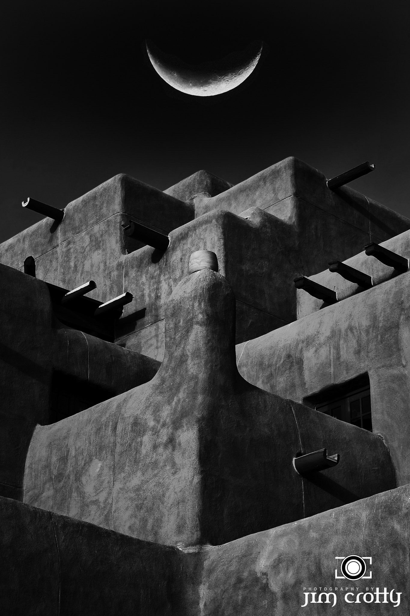 Digital art black and white composite photography of crescent Moon and adobe structure in Santa Fe by Jim Crotty