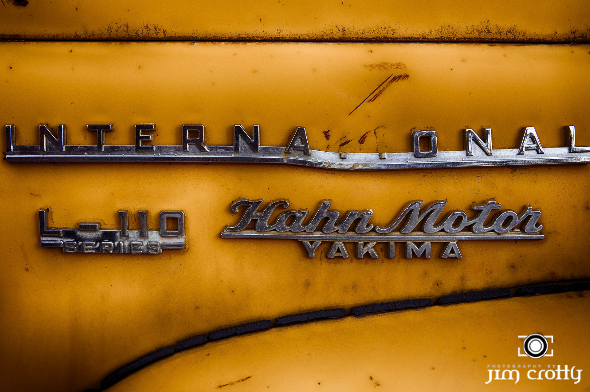 Old cars and landscape in Questa, New Mexico by Jim Crotty
