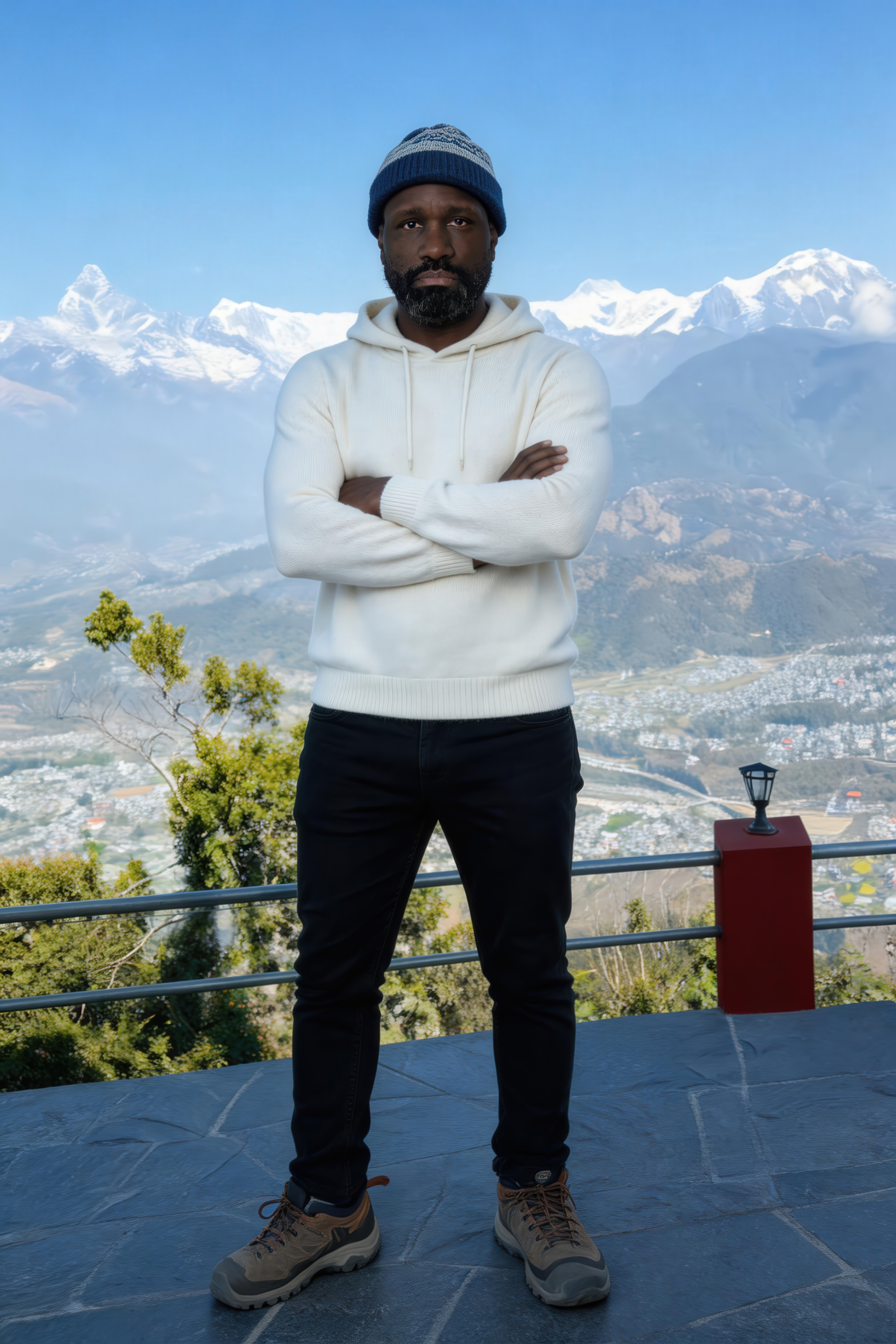NYC photographer Ken Jones, in Nepal standing in front of the Himalayan mountains