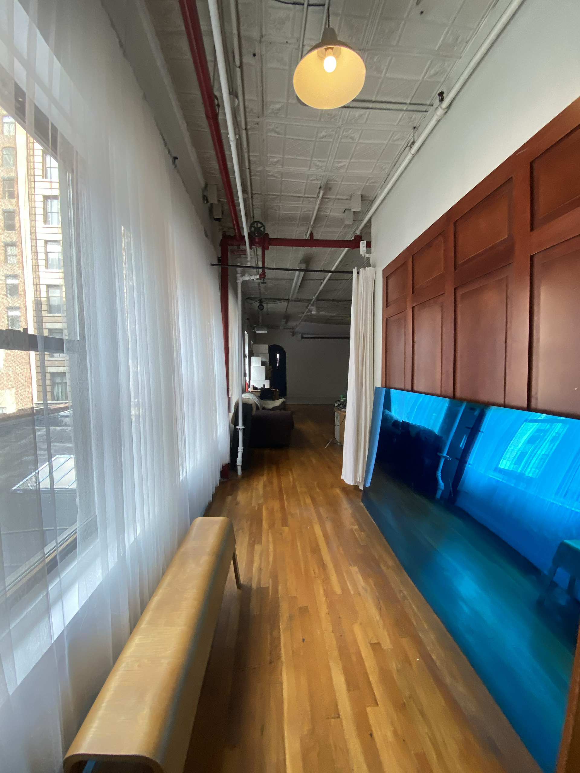 Natural light hallway leading into Manhattan photography studio rental space