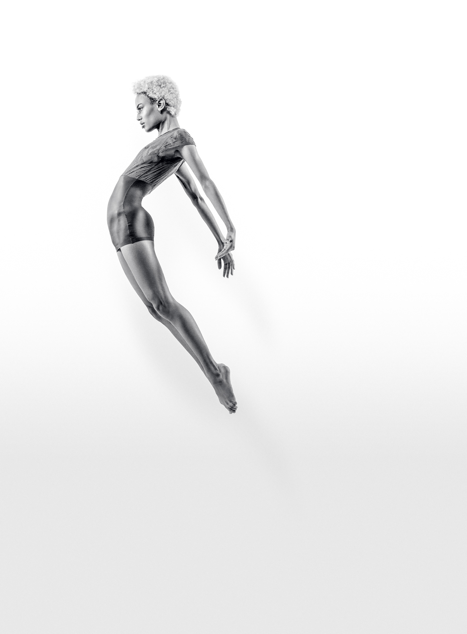 Girl jumping through the air in Black and white