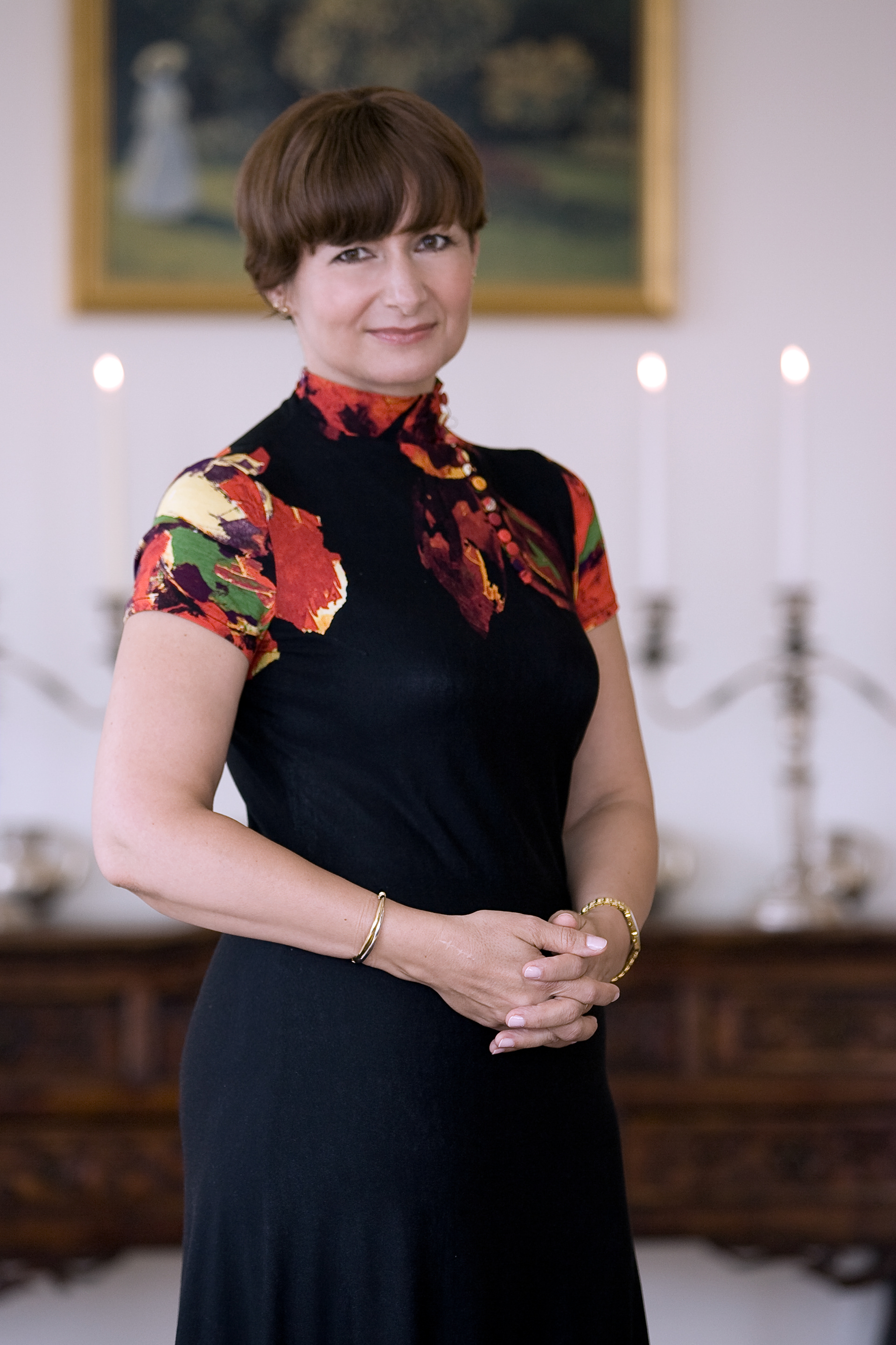 Editorial portrait of Simona‑Mirela Miculescu photographed in her Manhattan apartment near the United Nations during an interview feature.