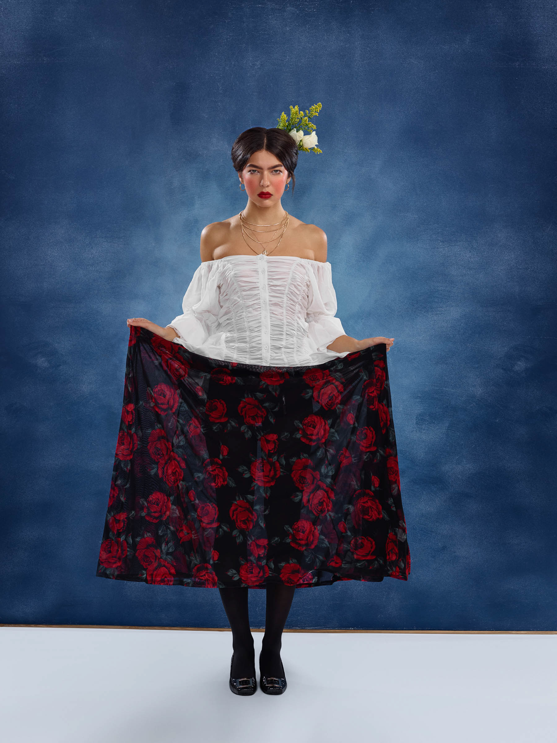 Frida Kahlo inspired portrait with flamenco style pose and flowers in hair