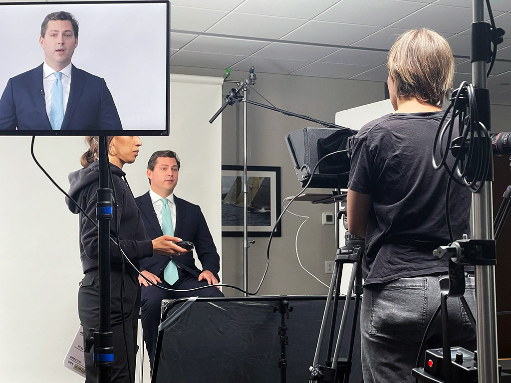 Corporate interview video production setup with lighting and camera equipment in NYC studio
