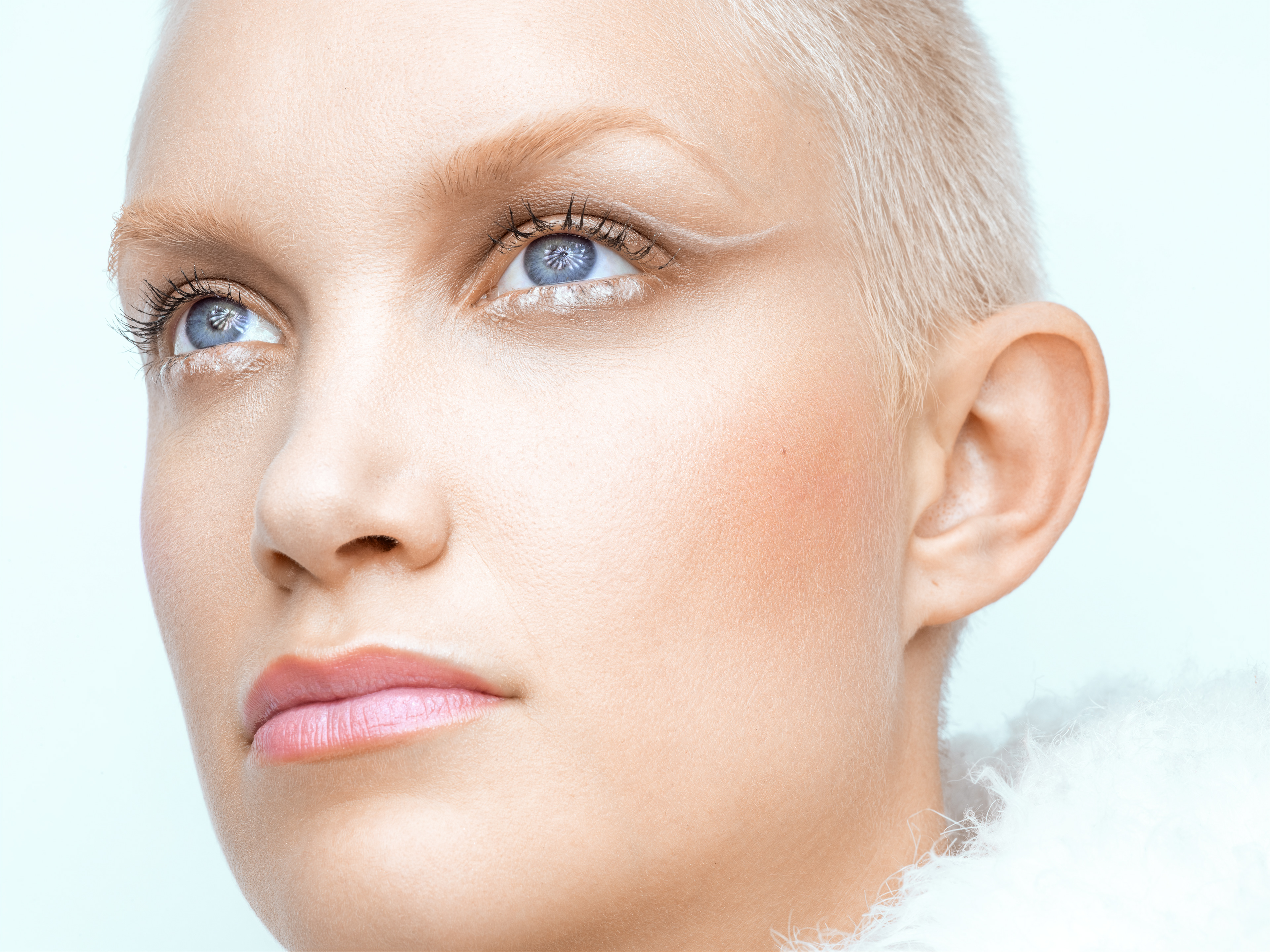 Close-up beauty portrait emphasizing facial expression and skin tones.