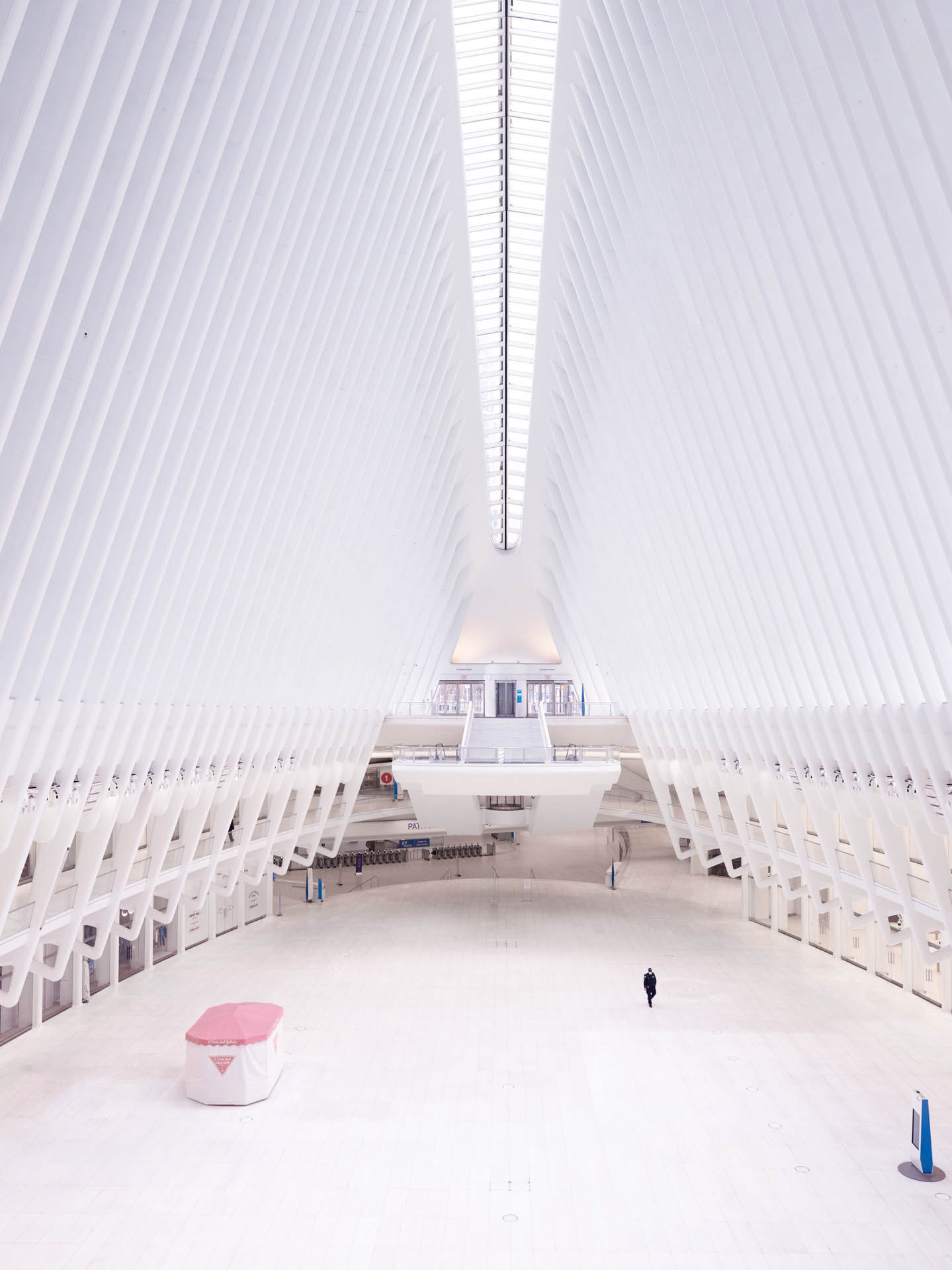 Empty Westfield World Trade Center interior near the Oculus during Covid, photographed with escalators, glass, and quiet public space.
