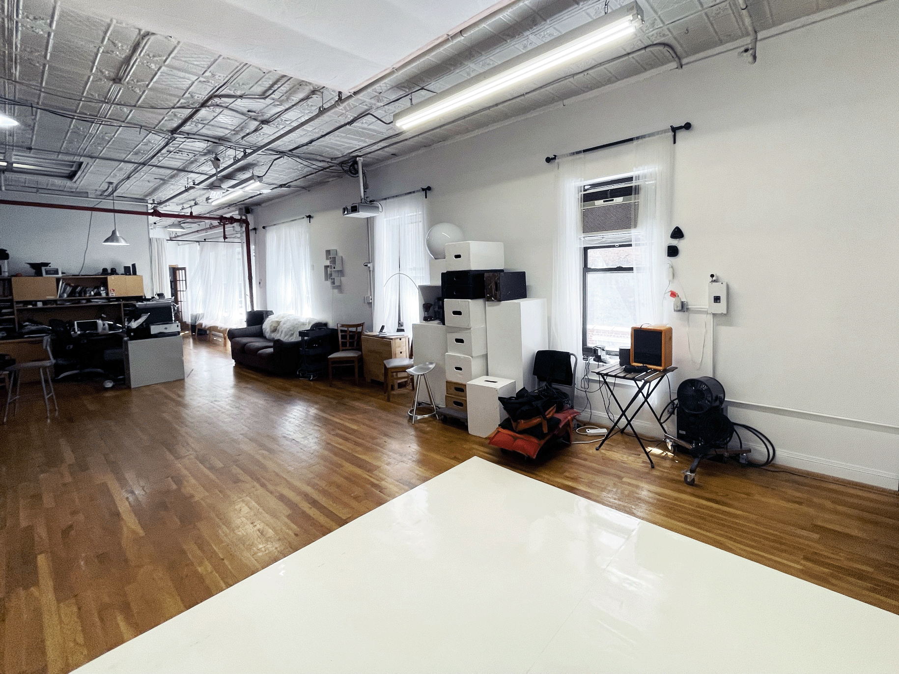 View of Manhattan photo studio rental from shooting backdrop showing full studio workspace