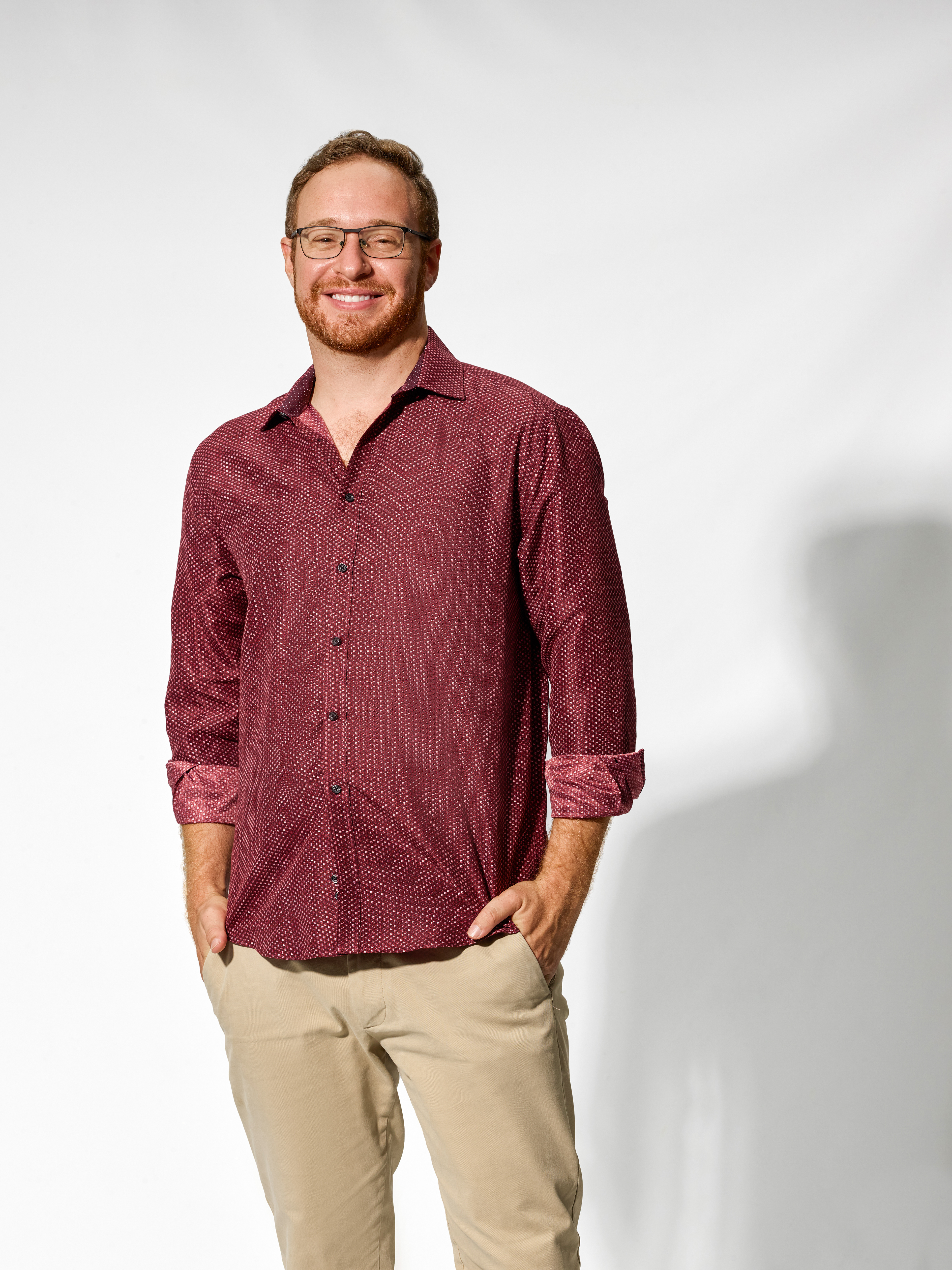 Lifestyle business portrait photographed in studio with natural expression.