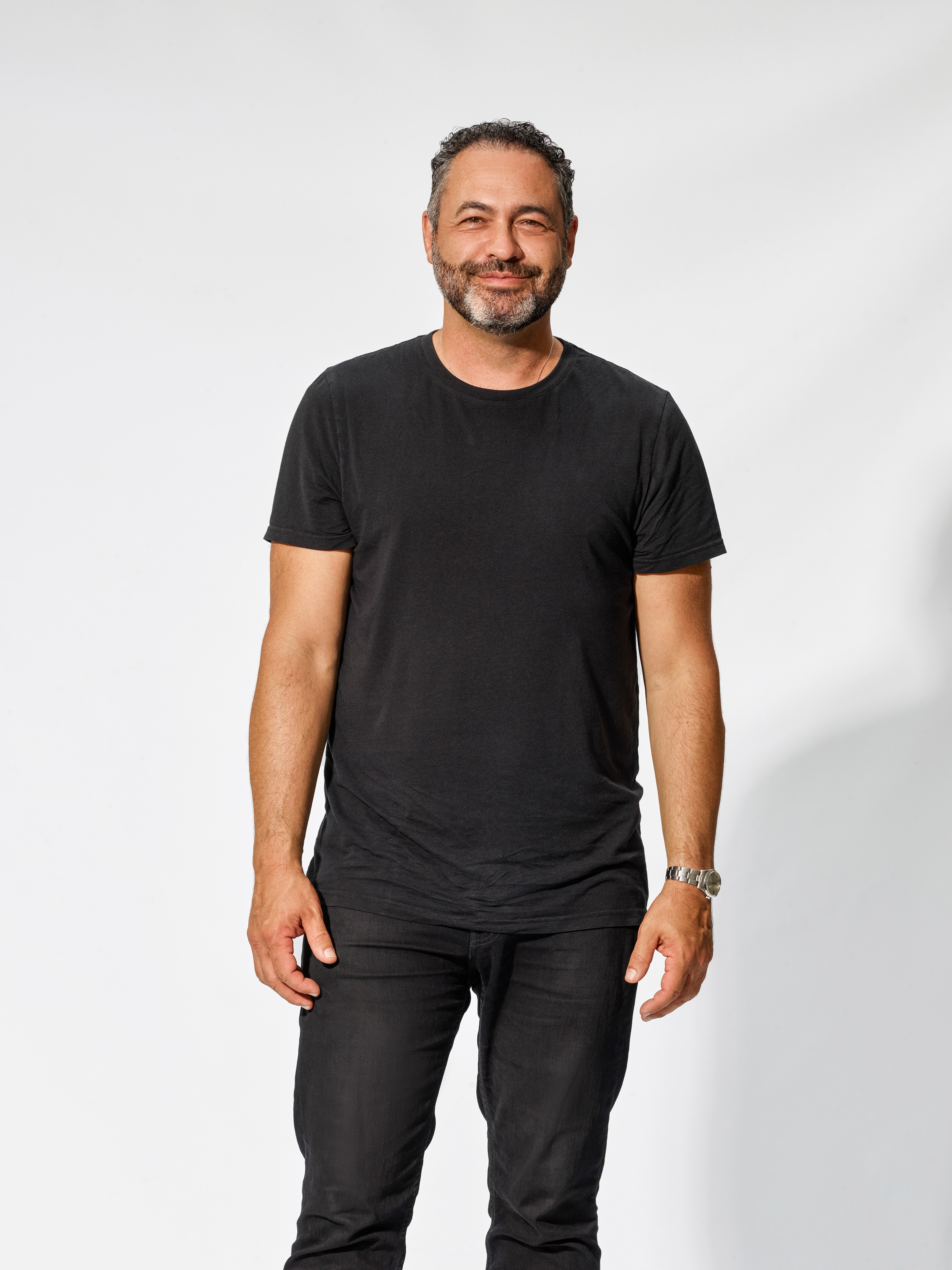 Relaxed corporate portrait photographed for personal brand marketing.