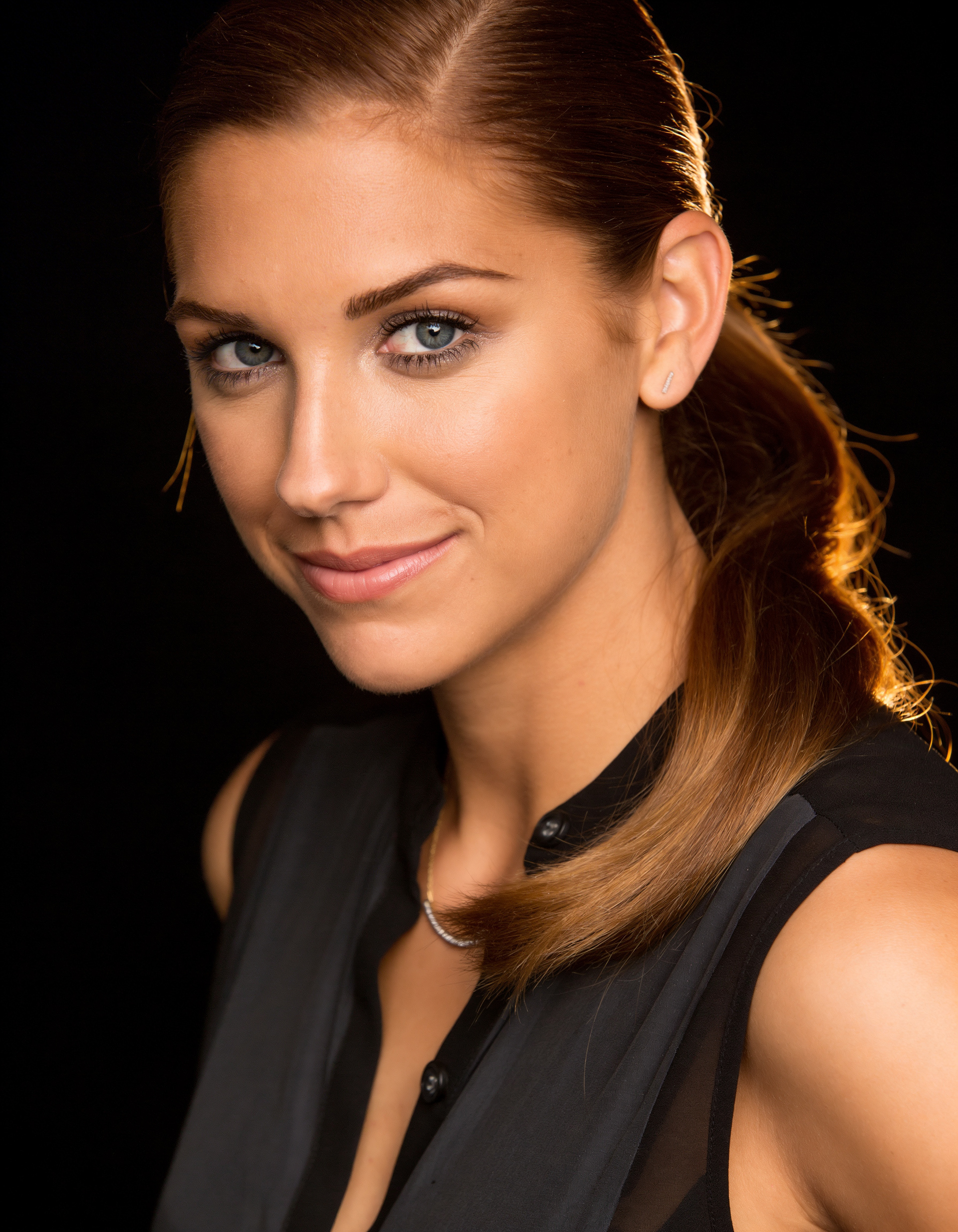 Studio beauty headshot of Alex Morgan with soft lighting and clean background for editorial and PR use
