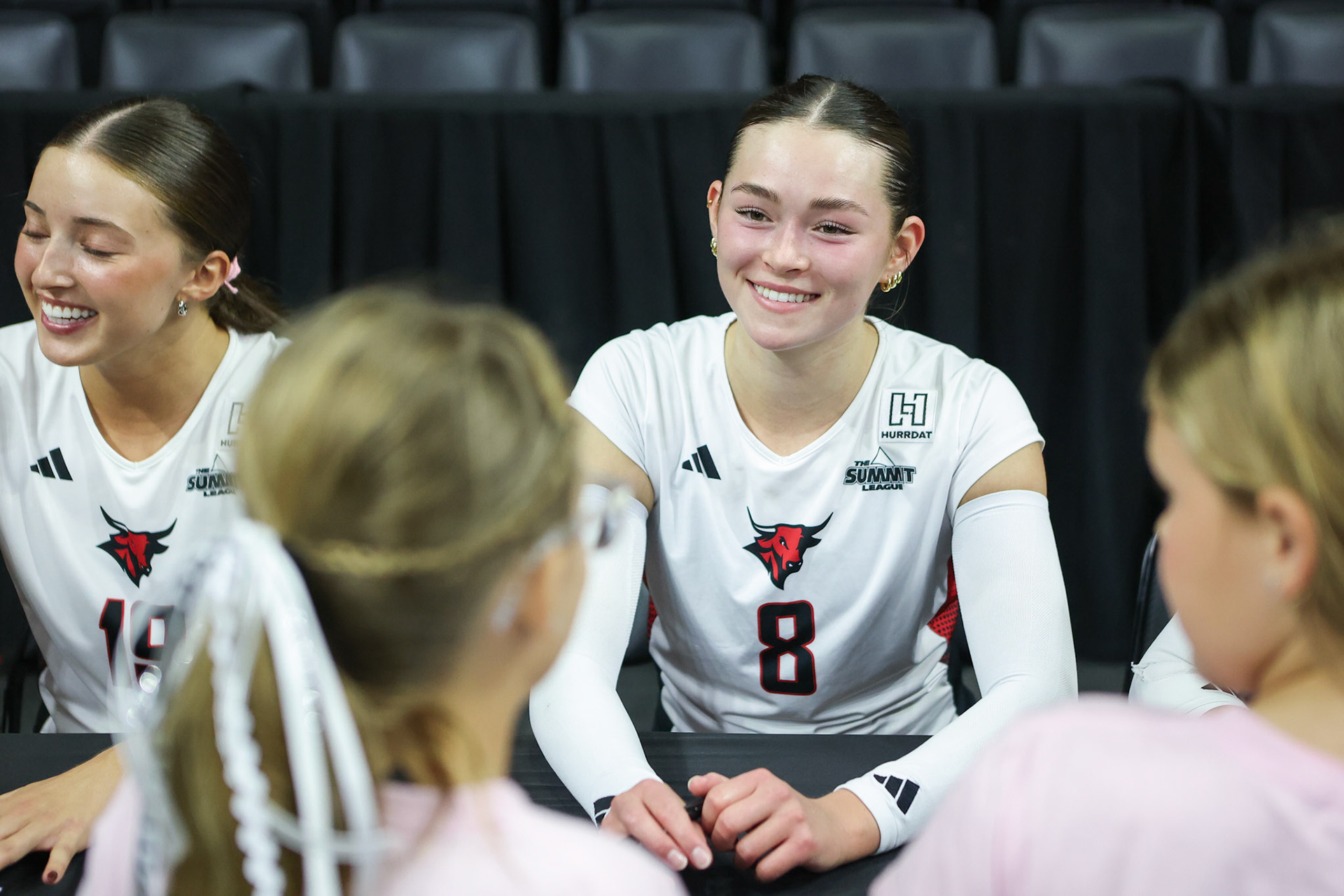 Omaha Mavericks setter Maddie Stuesser (8) interacts with young fans following a volleyball match against the Kansas State Wildcats at Baxter Arena in Omaha, Nebraska, on Saturday, September 19, 2026. Photo by Abdoul Sow