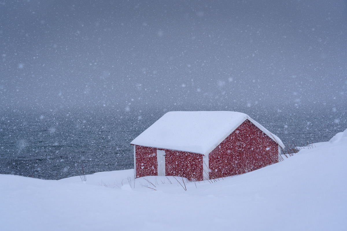 Red cabin in a blizzard