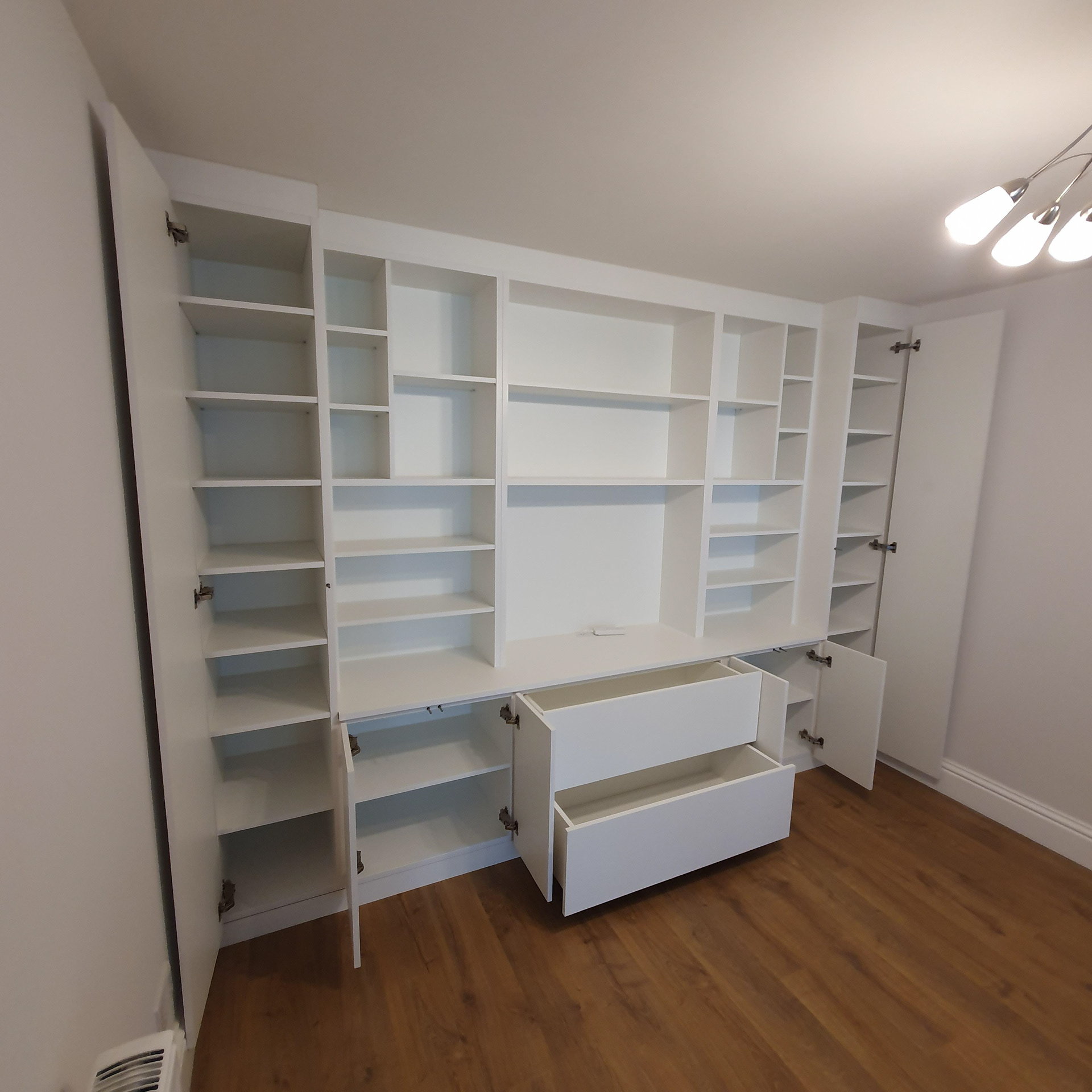 Bespoke Media unit and storage. Push to open doors and drawers with Blum Hardware and Blumotion soft close.