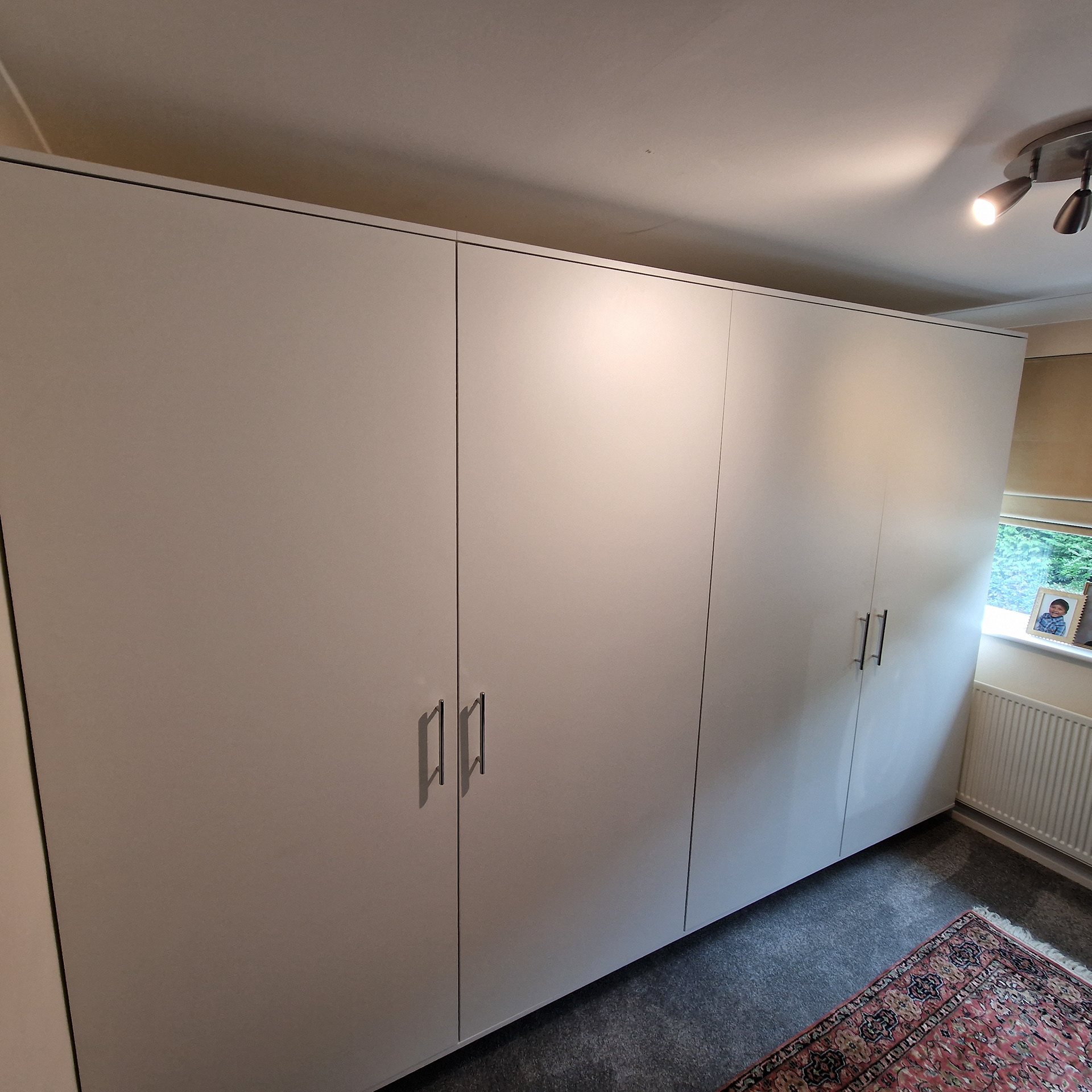 Four bespoke, fitted wardrobes with rails and two shelves. Blum hardware with Blumotion soft close.