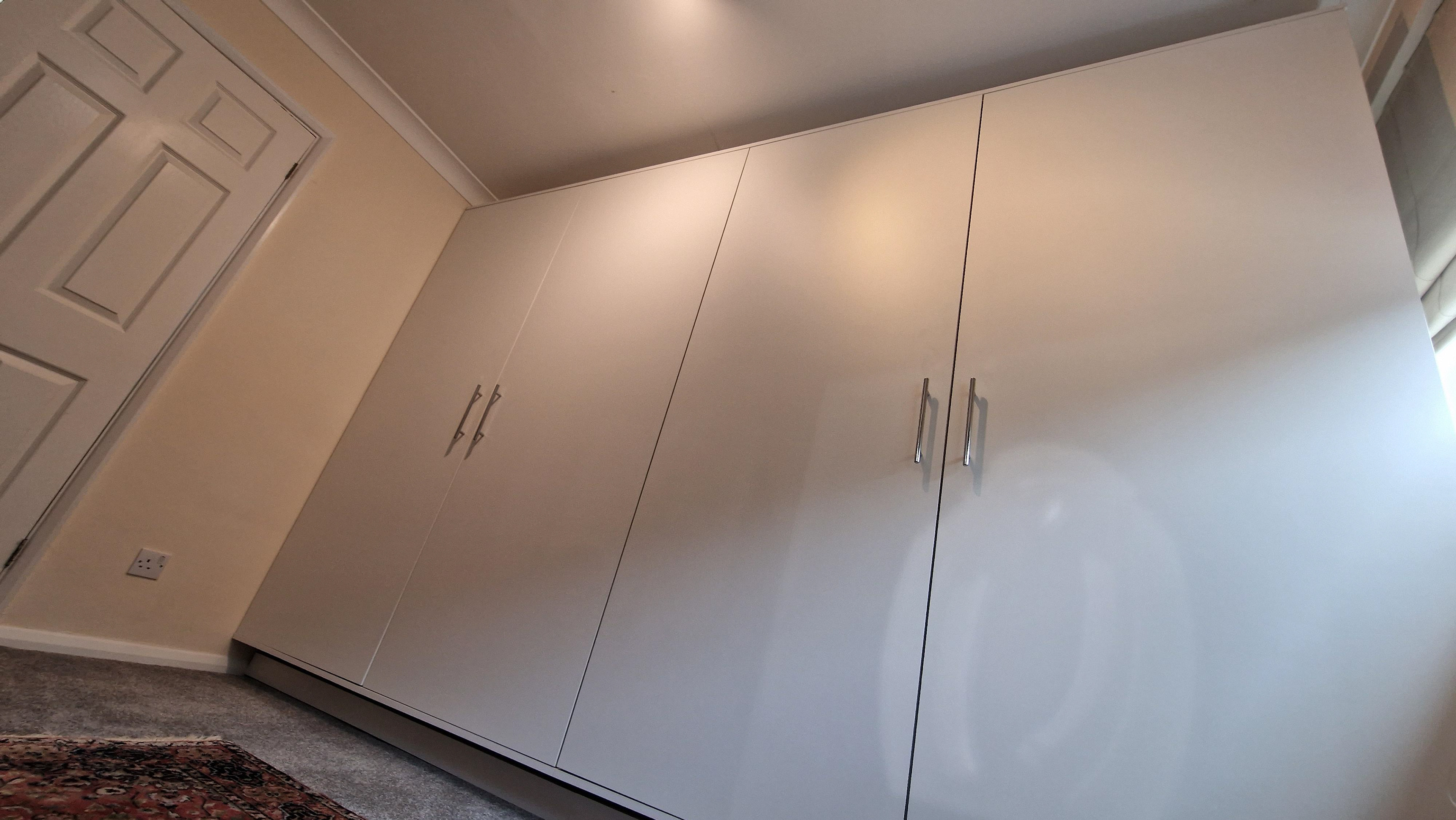 Four bespoke, fitted wardrobes with rails and two shelves. Blum hardware with Blumotion soft close.