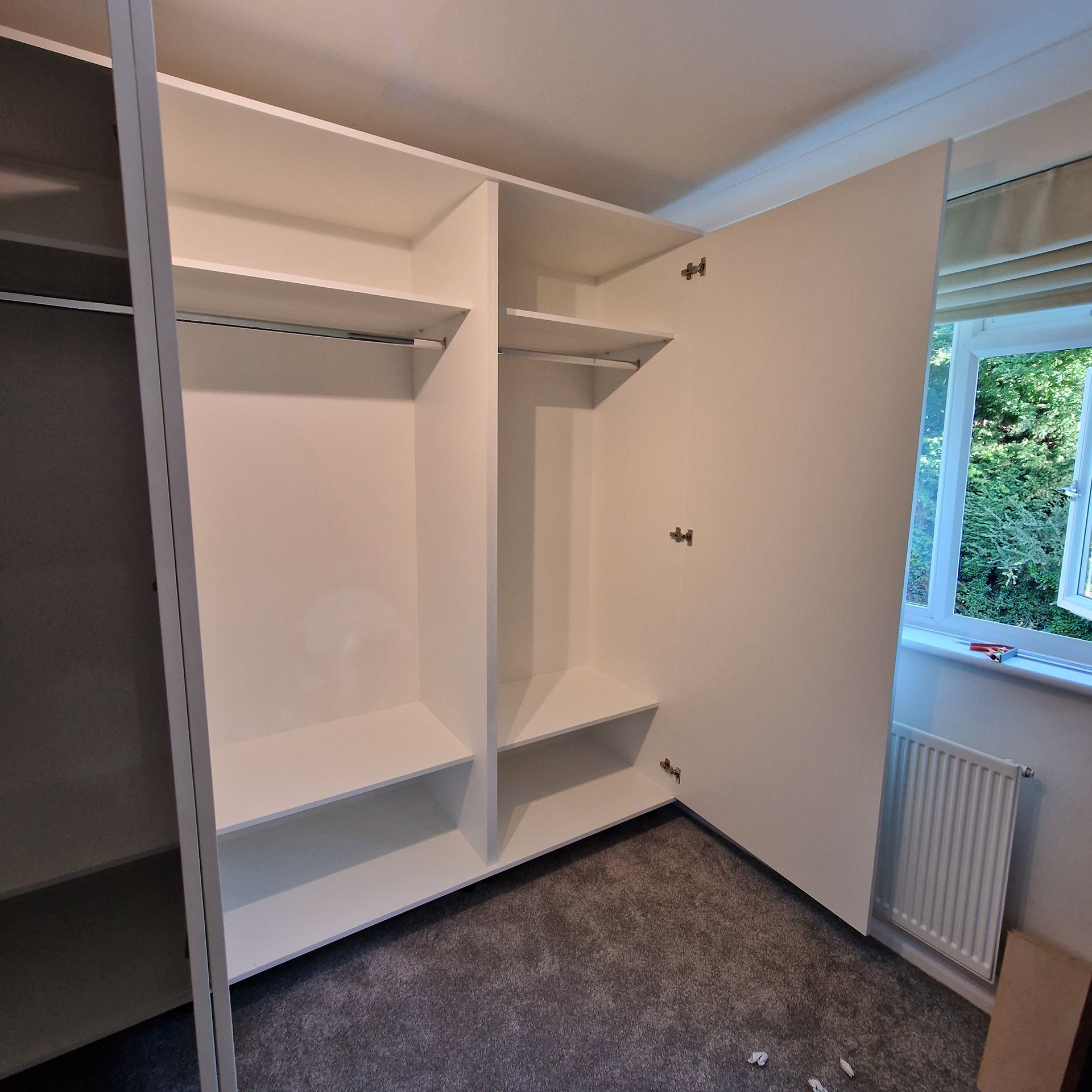 Four bespoke, fitted wardrobes with rails and two shelves. Blum hardware with Blumotion soft close.