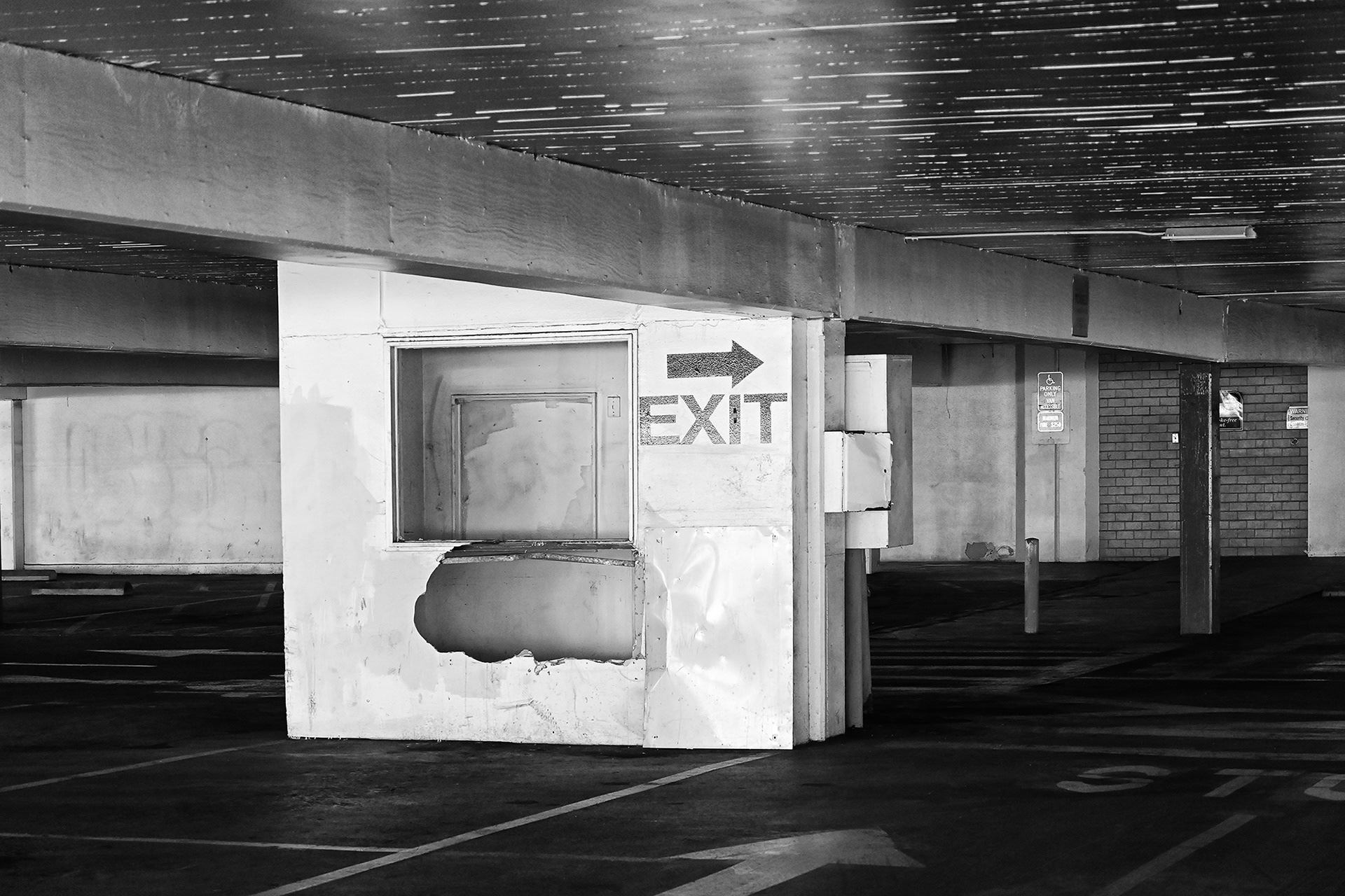 Exit sign in a Condemed Parking Garage, Santa Ana, black and white photograph 
