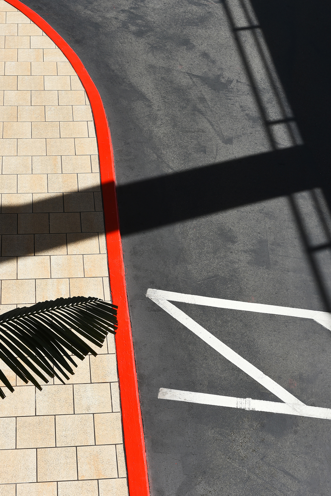 Long Beach Hyatt Regency Drive seen from above with red curved curb and crosswalk