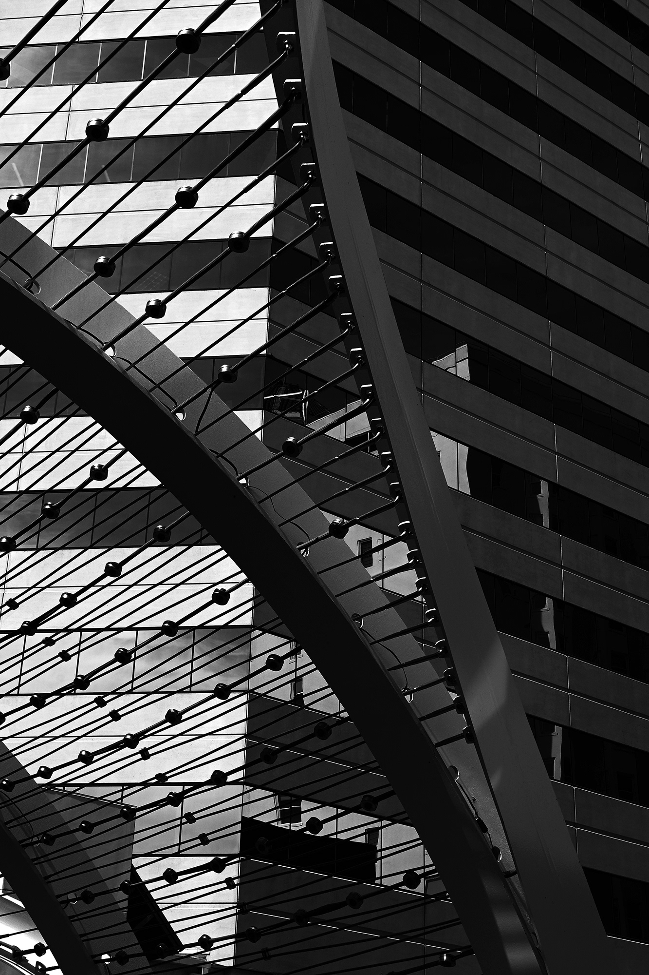 Rainbow Bridge, Building and Metal Arch, Long Beach, black and white photograph