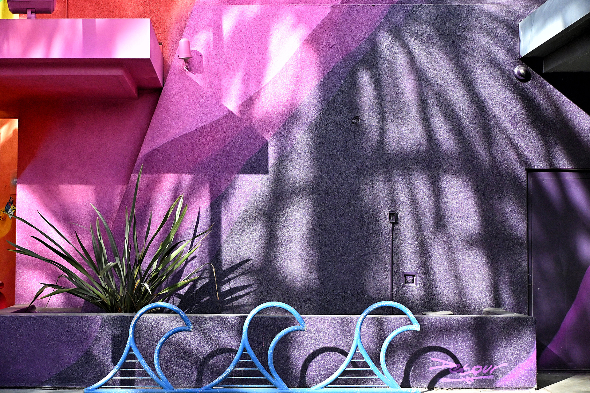 Blue Wave Bike Rack and Colorful Building, photograph