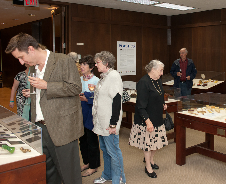 People in the main gallery viewing the Just One Word: Plastics exhibit