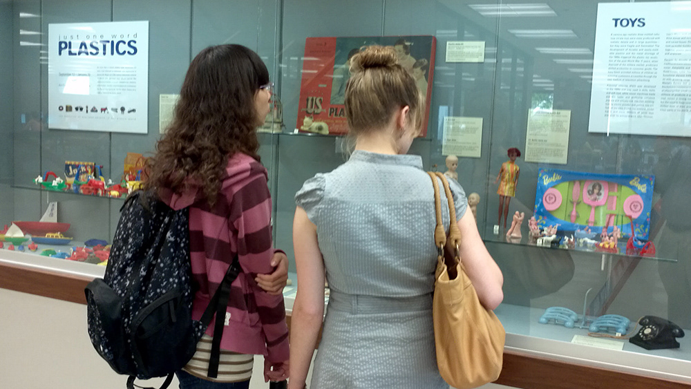 Two people looking at the first floor lobby display