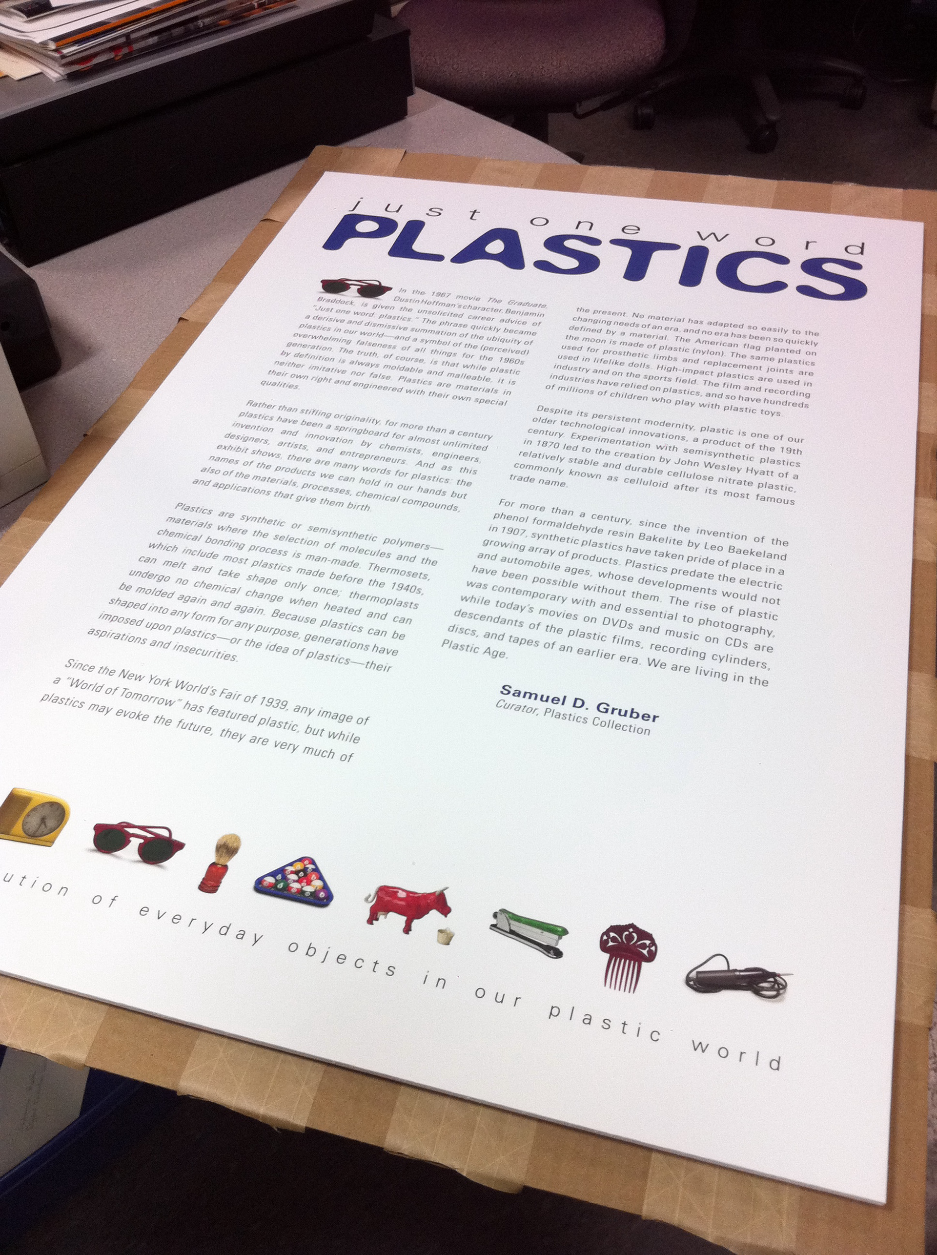 Proofing the introductory text wall graphic prior to exhibit install