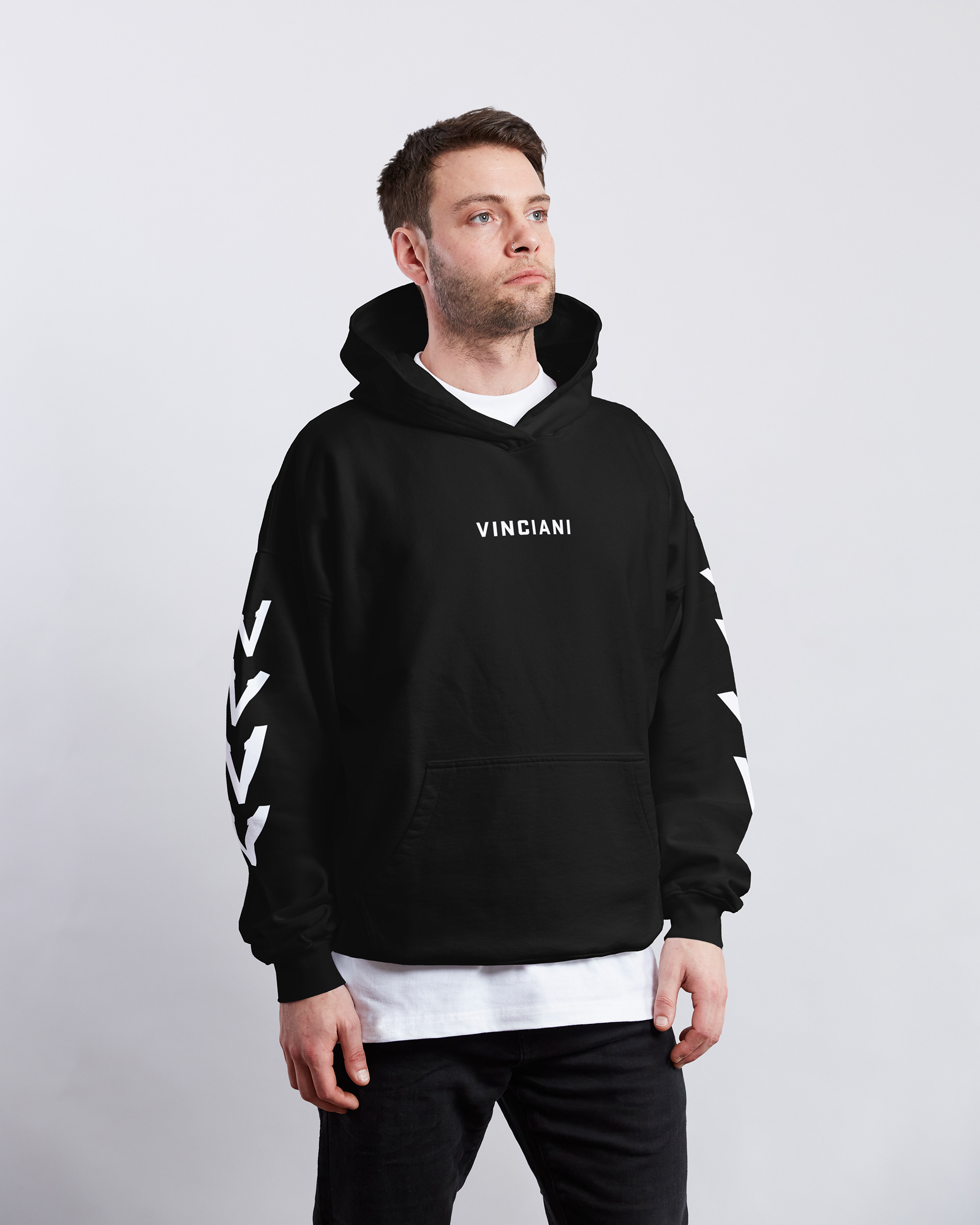 Black Vinciani hoodie with front logo and sleeve stripe detailing, premium streetwear design worn by male model, modern urban fashion front view.