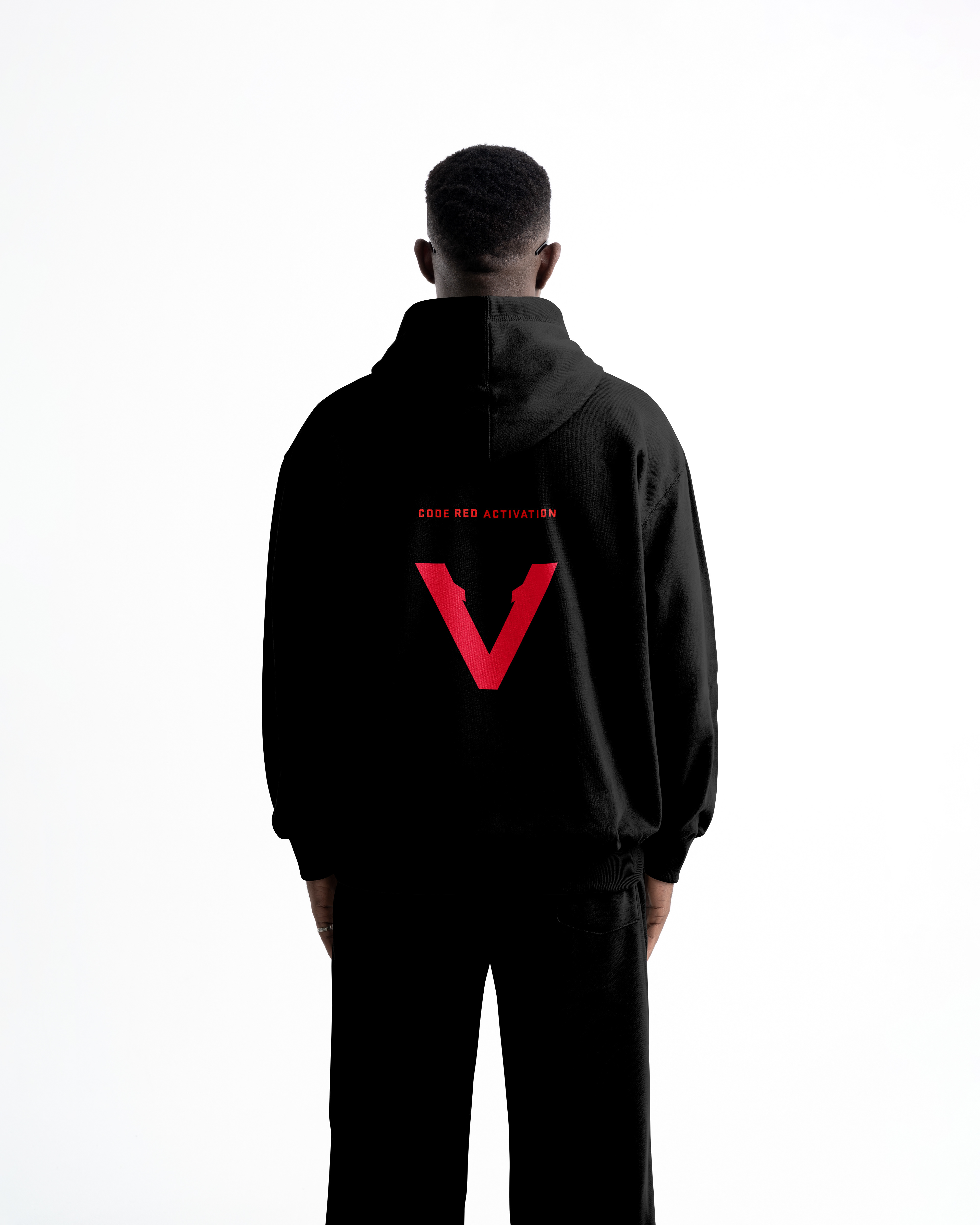 Black Vinciani hoodie with red V logo and 'Code Red Activation' text on back, streetwear design shown on model from rear view.