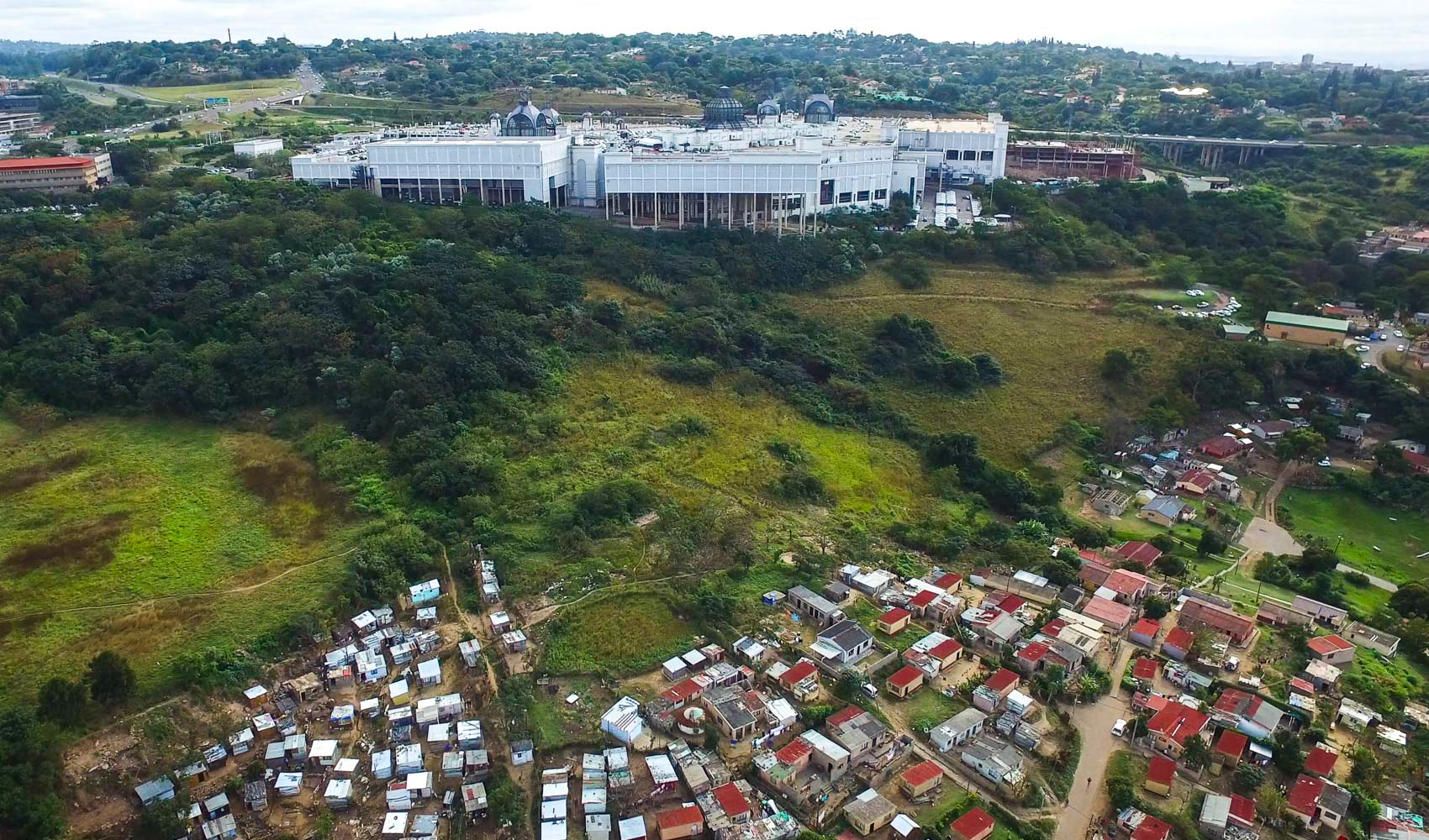 aerial view of shacks and shopping mall in durban