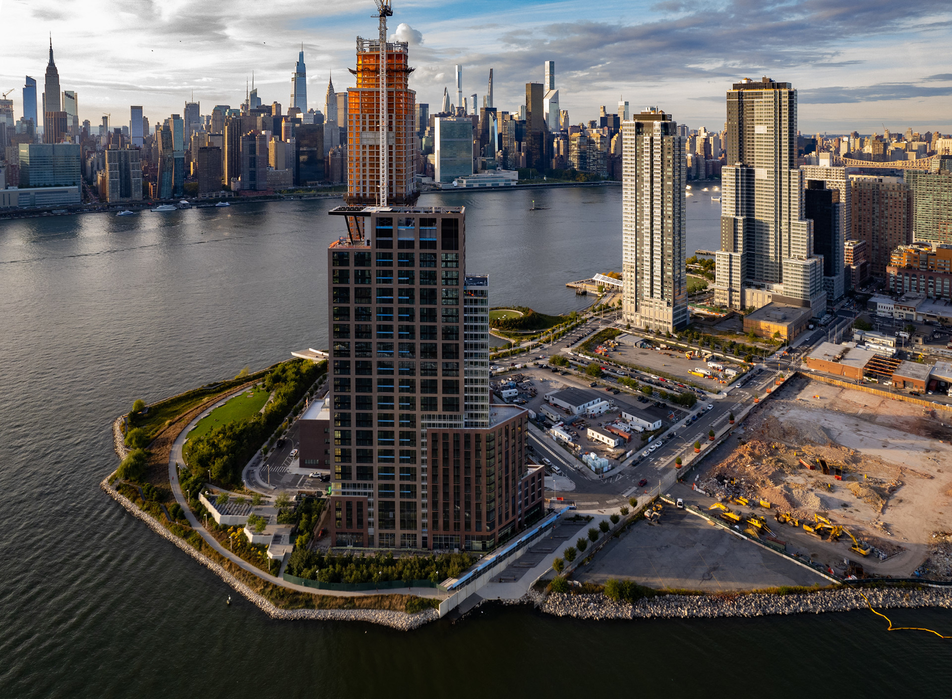 A drone photo of skyscrapers and a river.